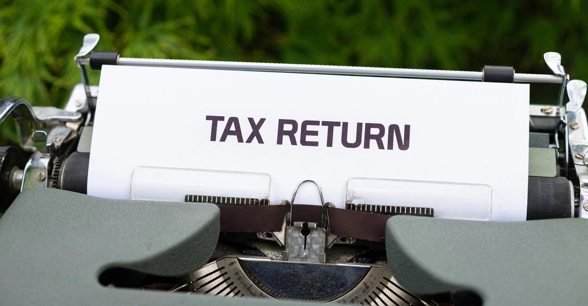 Typewriter with "Tax return" written on inside paper.