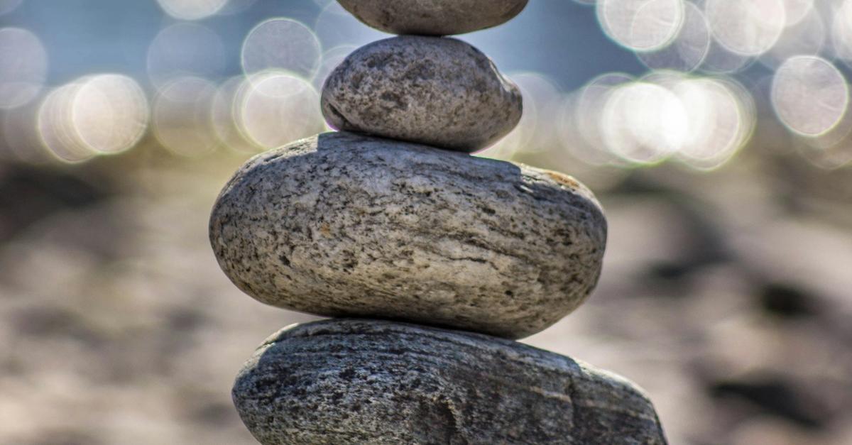 Rocks piled up on top of each other vertically.