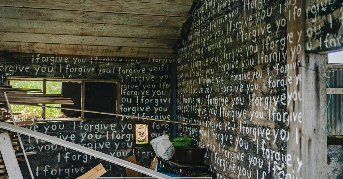 I forgive you written all over the inside of a house by Bailey Burton.