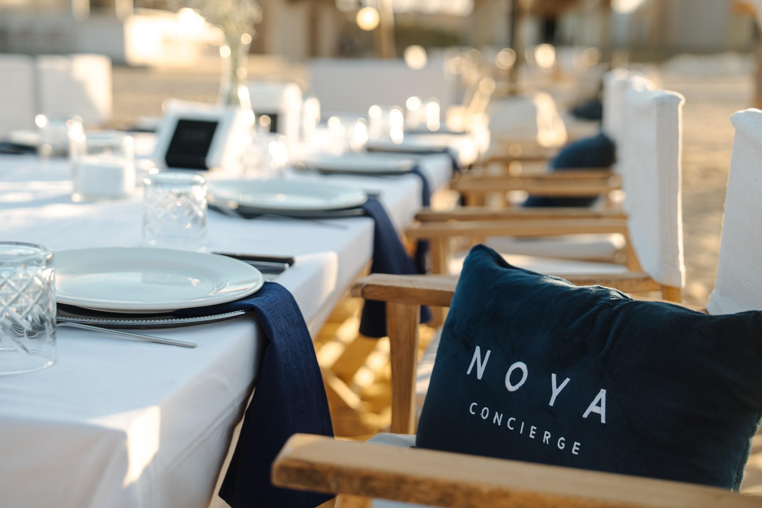A row of place settings with NOYA cushions