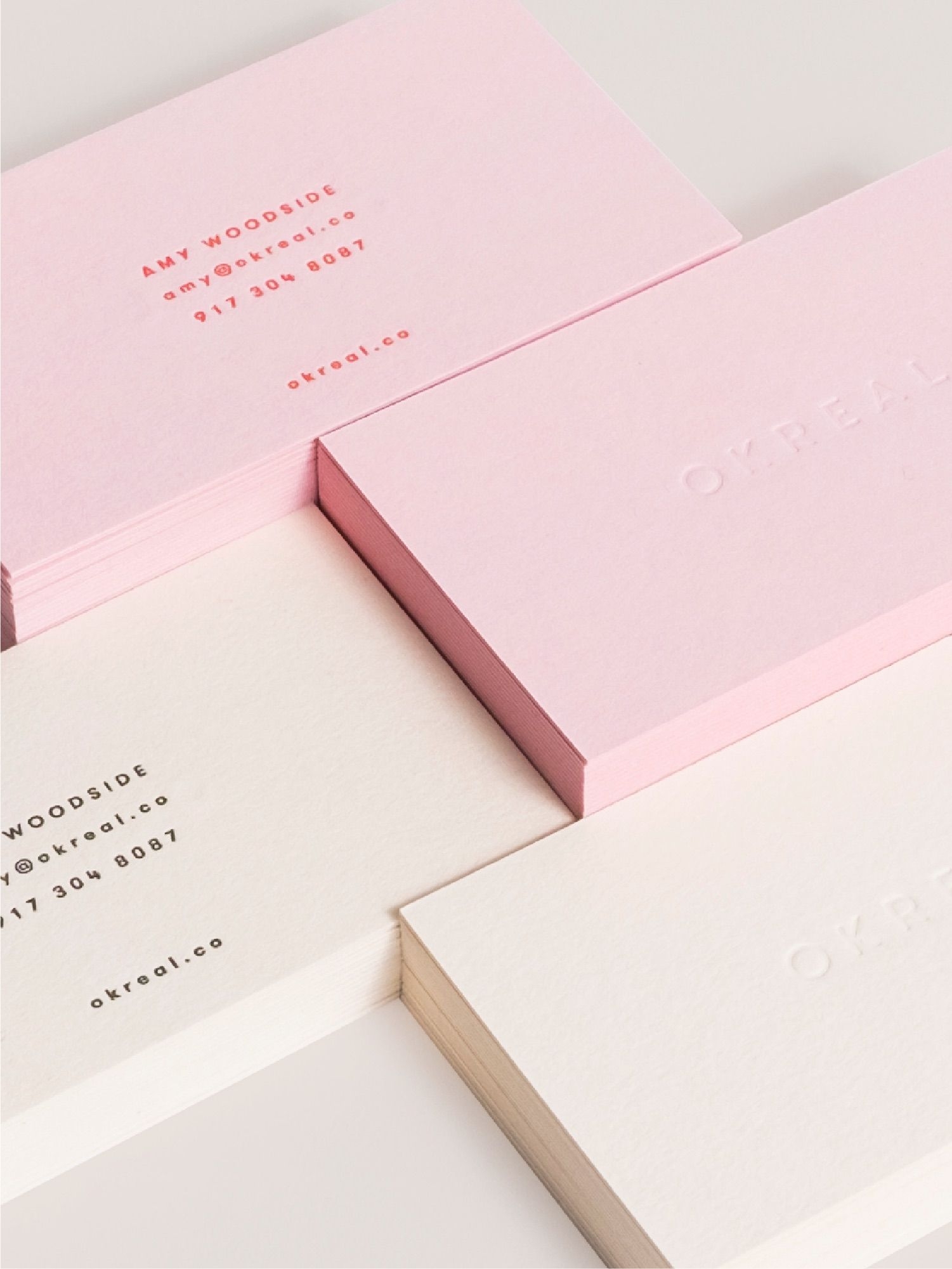Cover for OKREAL showing a closeup of stacked business cards