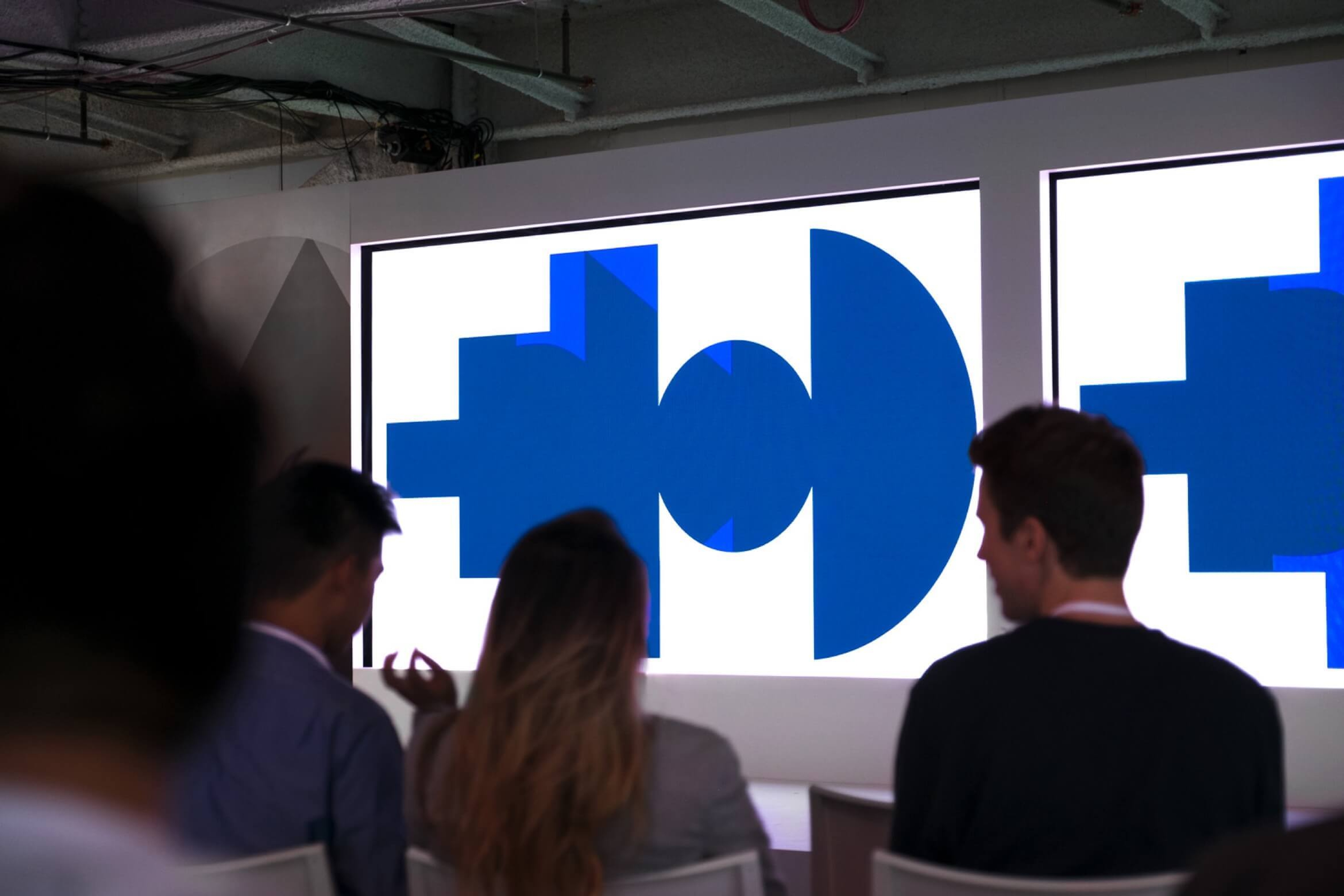 Photo of stage with Google Span shapes on displays