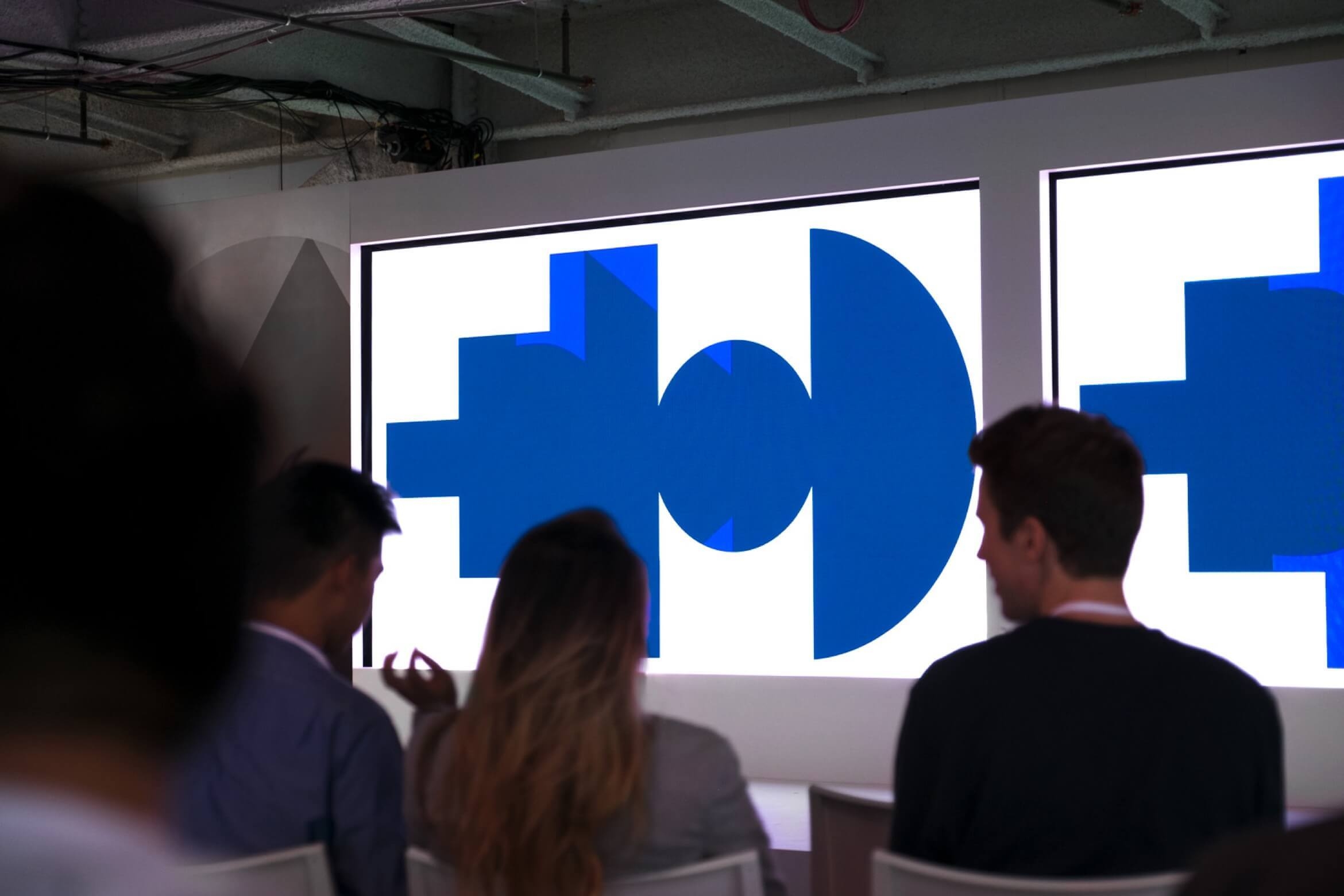 Photo of stage with Google Span shapes on displays