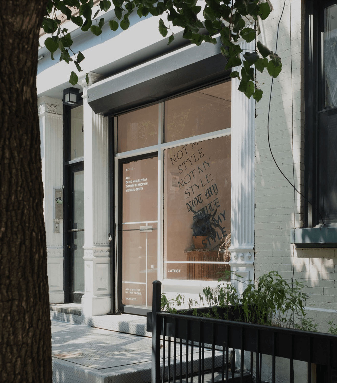 Cover for XXXI showing the former storefront