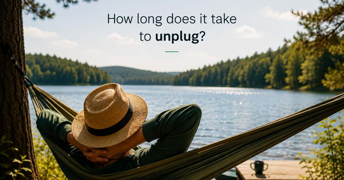 Person relaxing in a hammock by a peaceful lake during vacation, illustrating how long it takes the brain to fully unplug and recover from work.