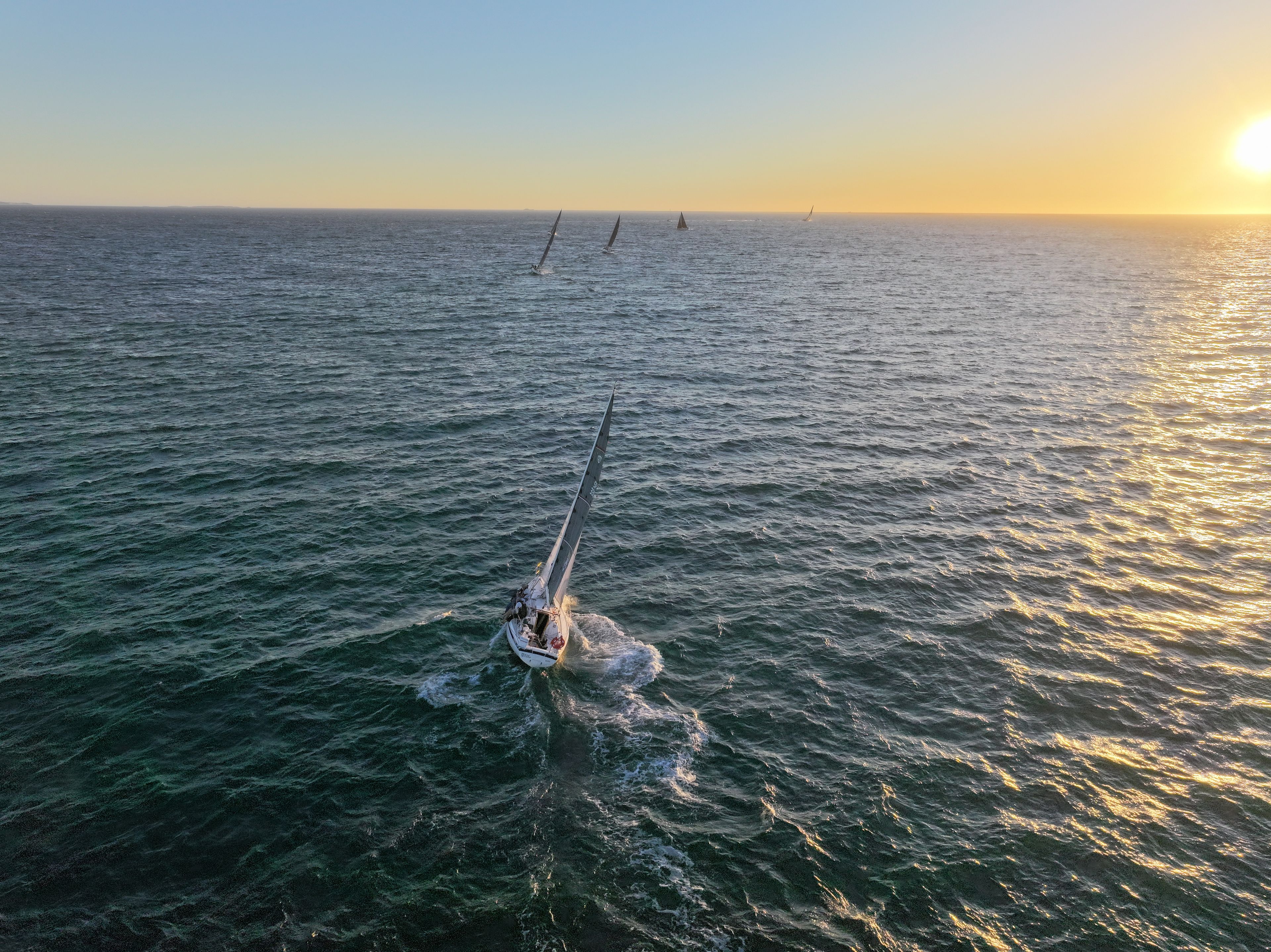 Yachts race towards the horizon
