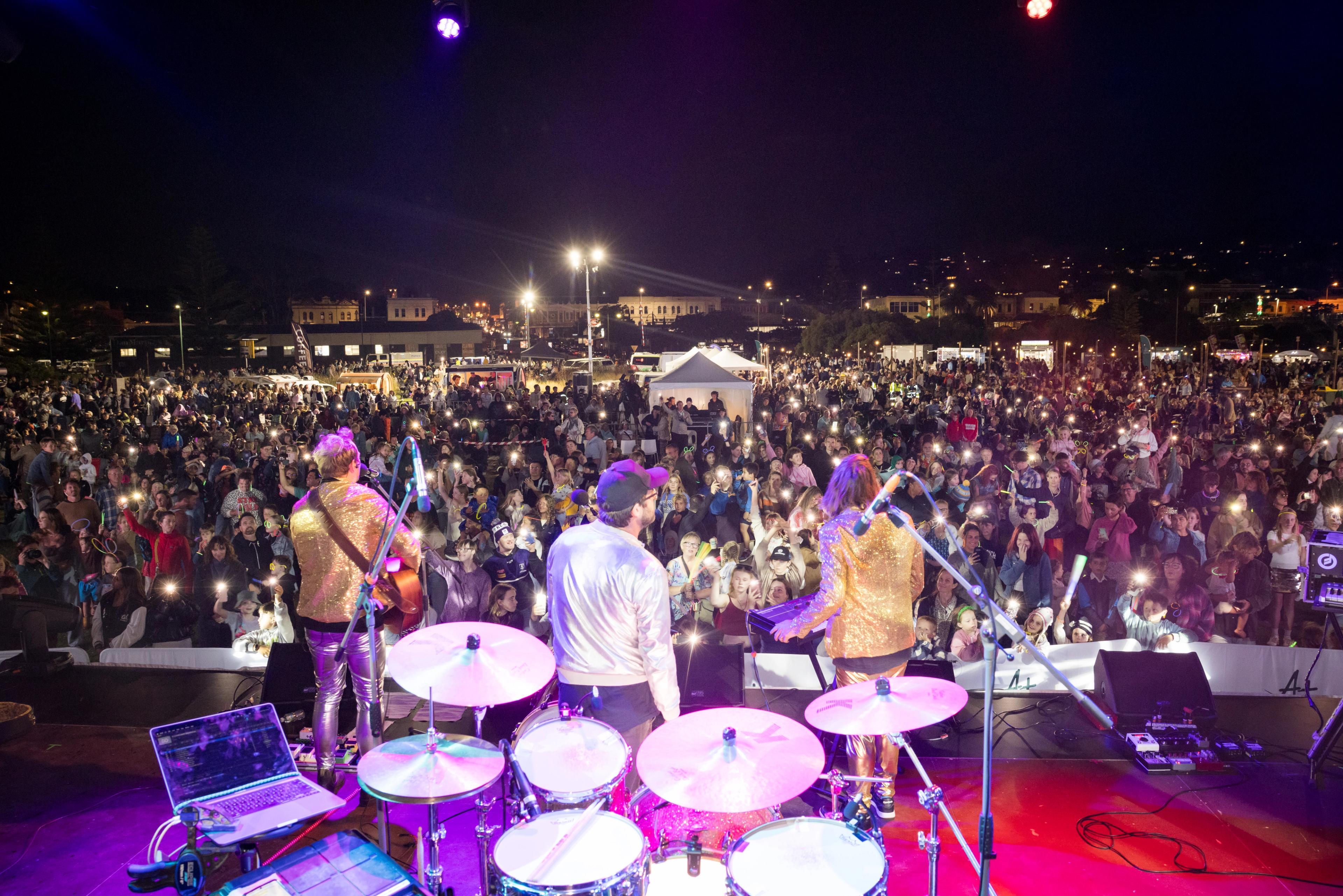 A crowd of people gather at the main stage