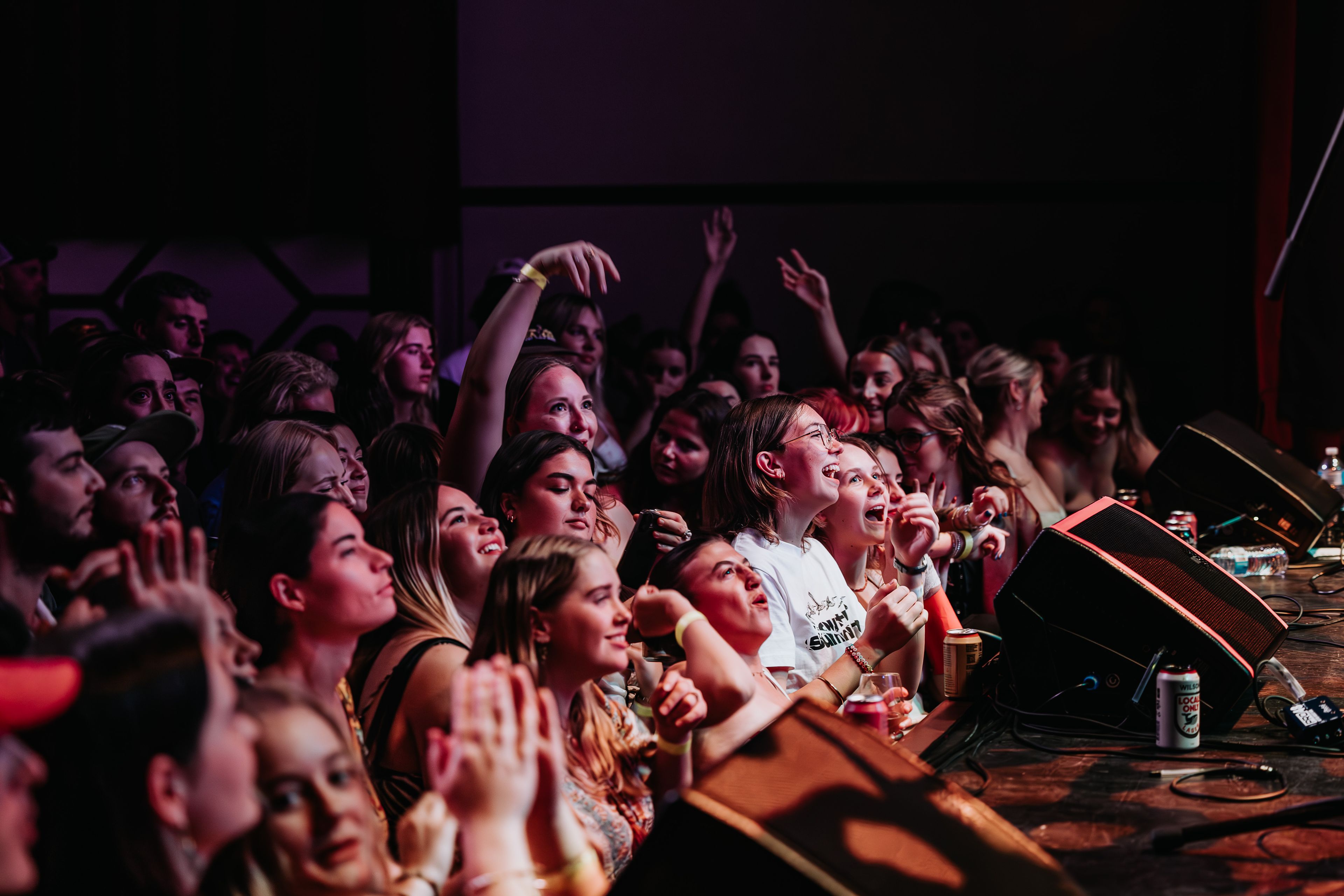 A packed crowd before a stage