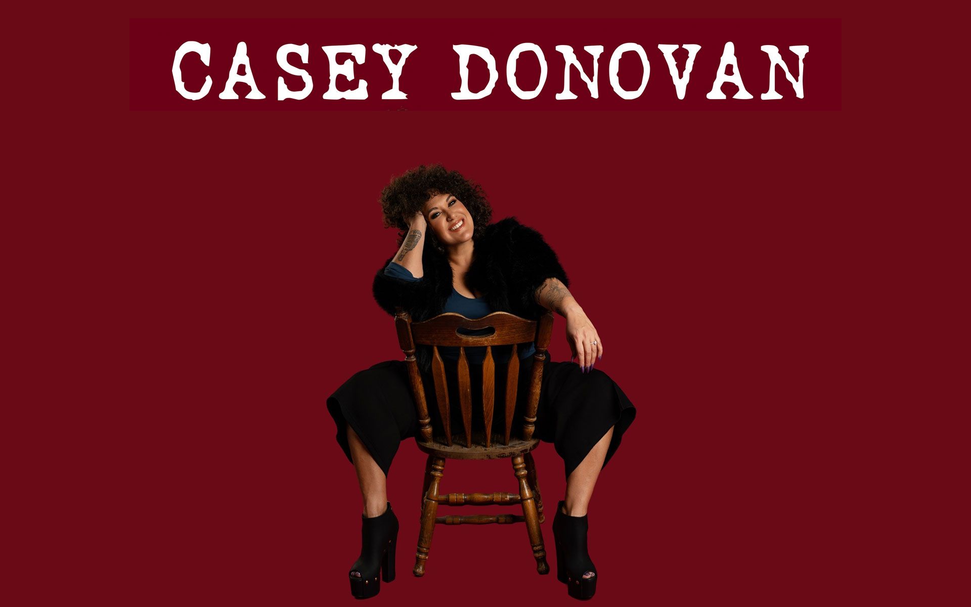 Casey Donavan sitting incorrectly in a chair