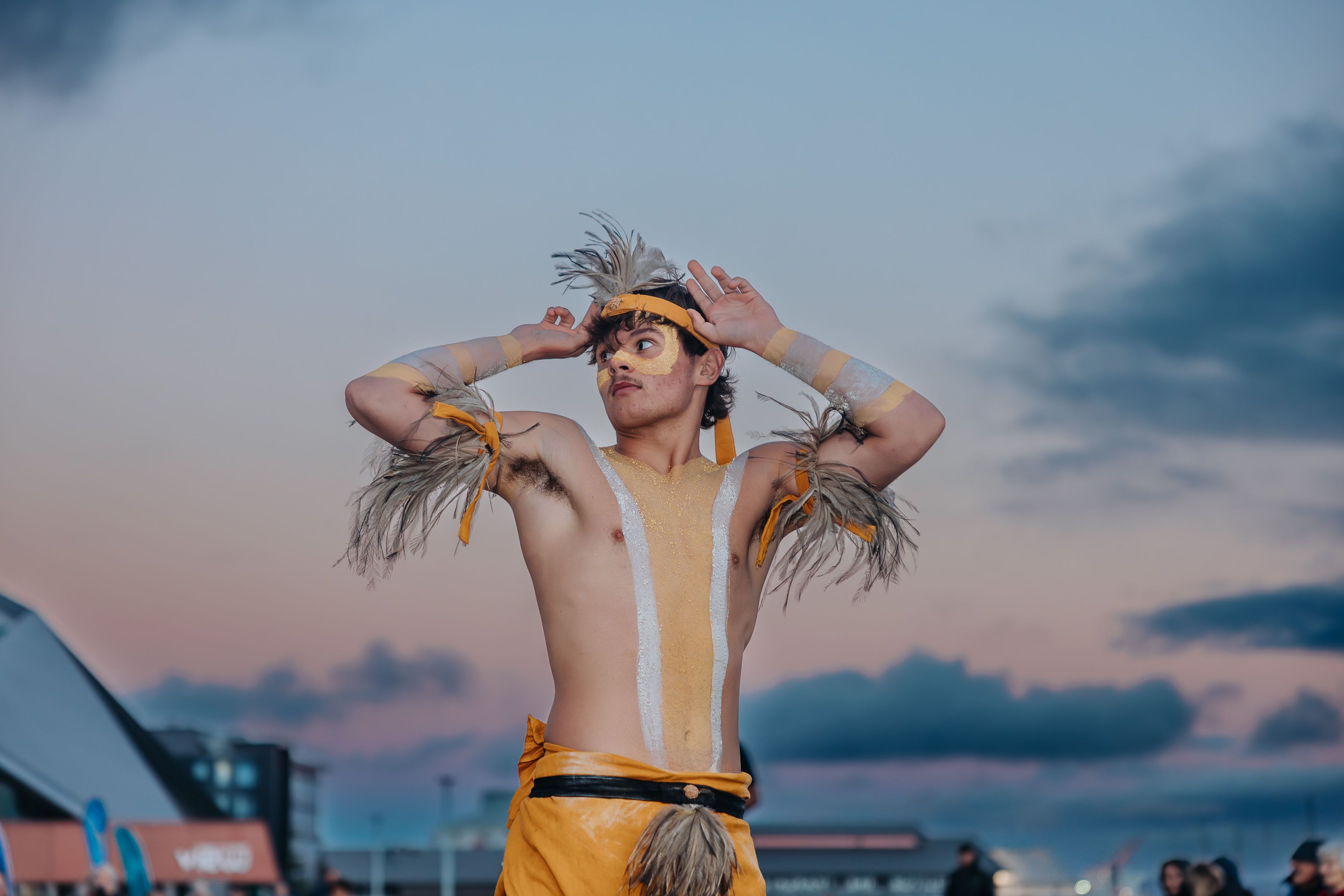 Cultural performer before a sunset