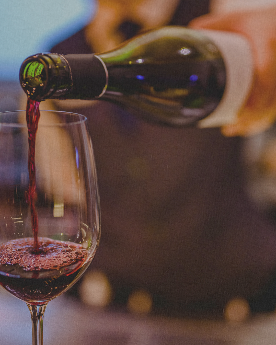 Red wine being poured