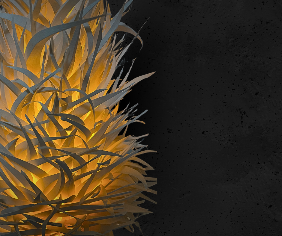 An intricate paper lantern before a dark background