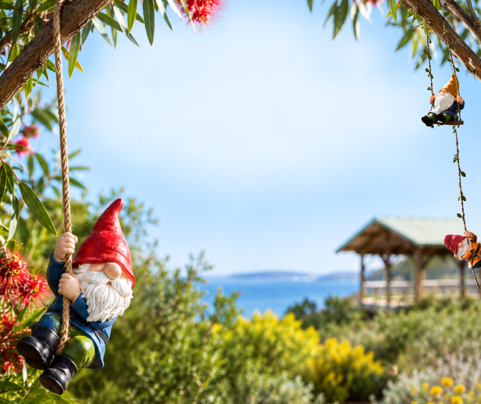 A gnome hangs from a rope with the ocean seen in the background