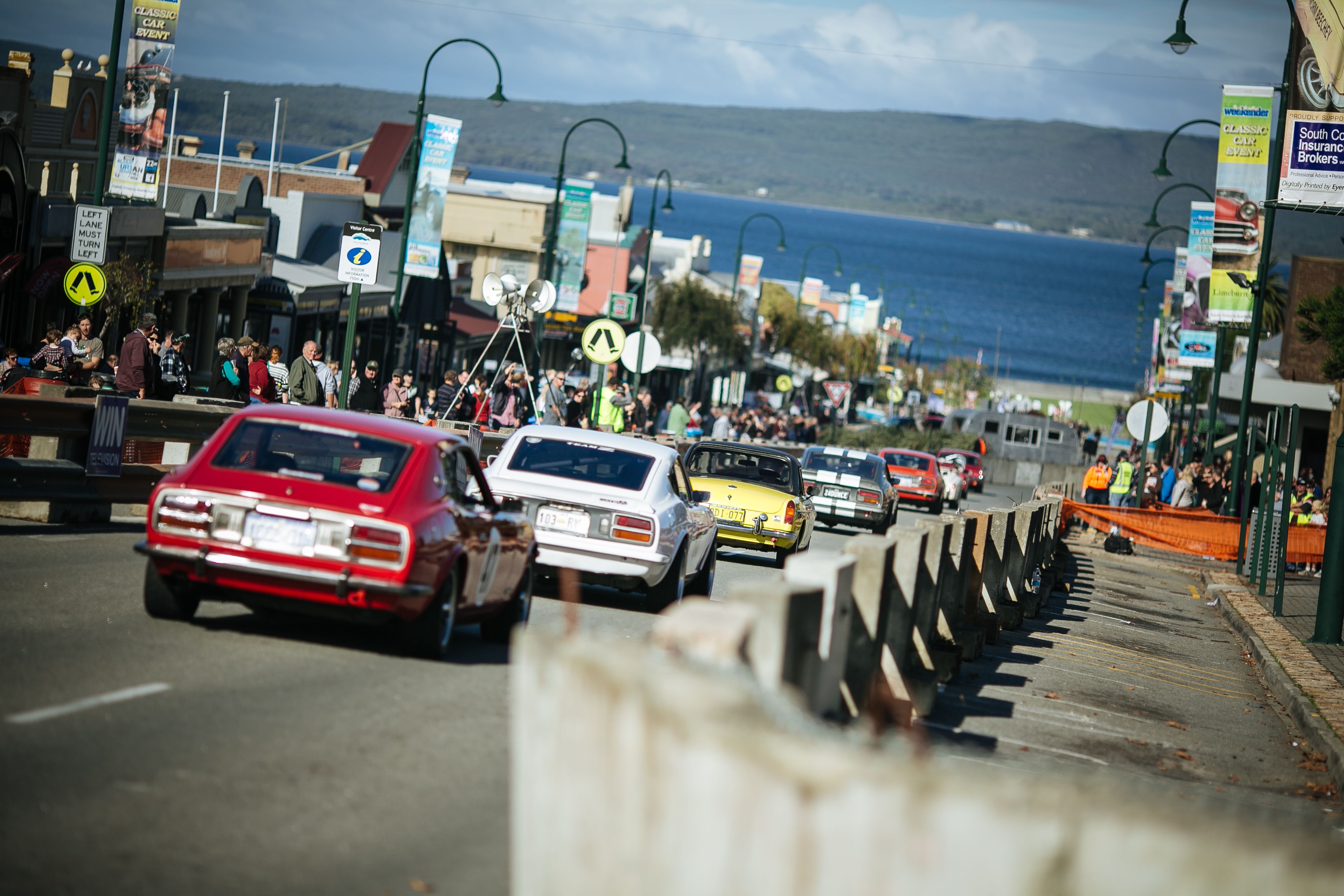 Colourful vintage cars race down the main street of Albany.