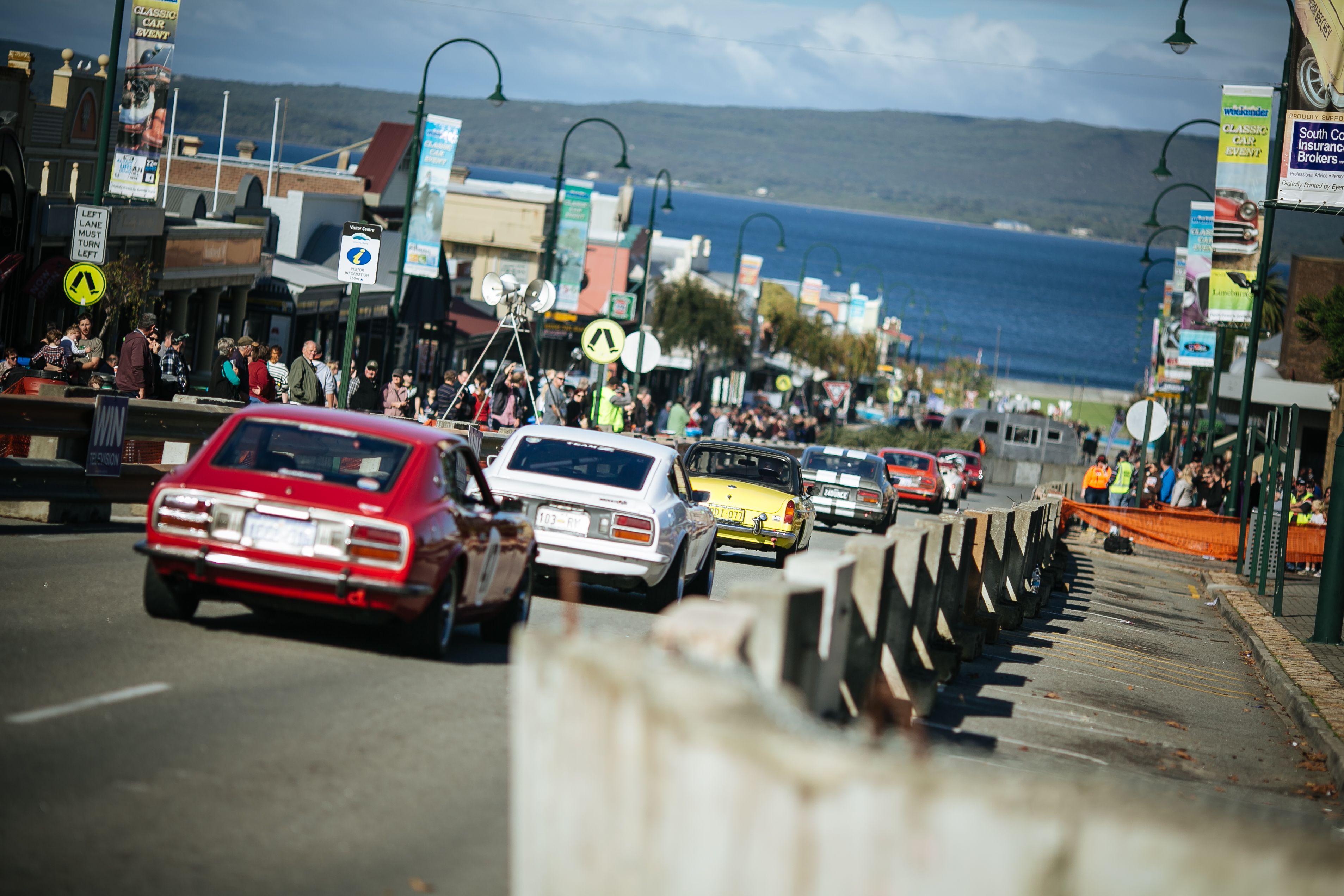 Colourful vintage cars race down the main street of Albany.