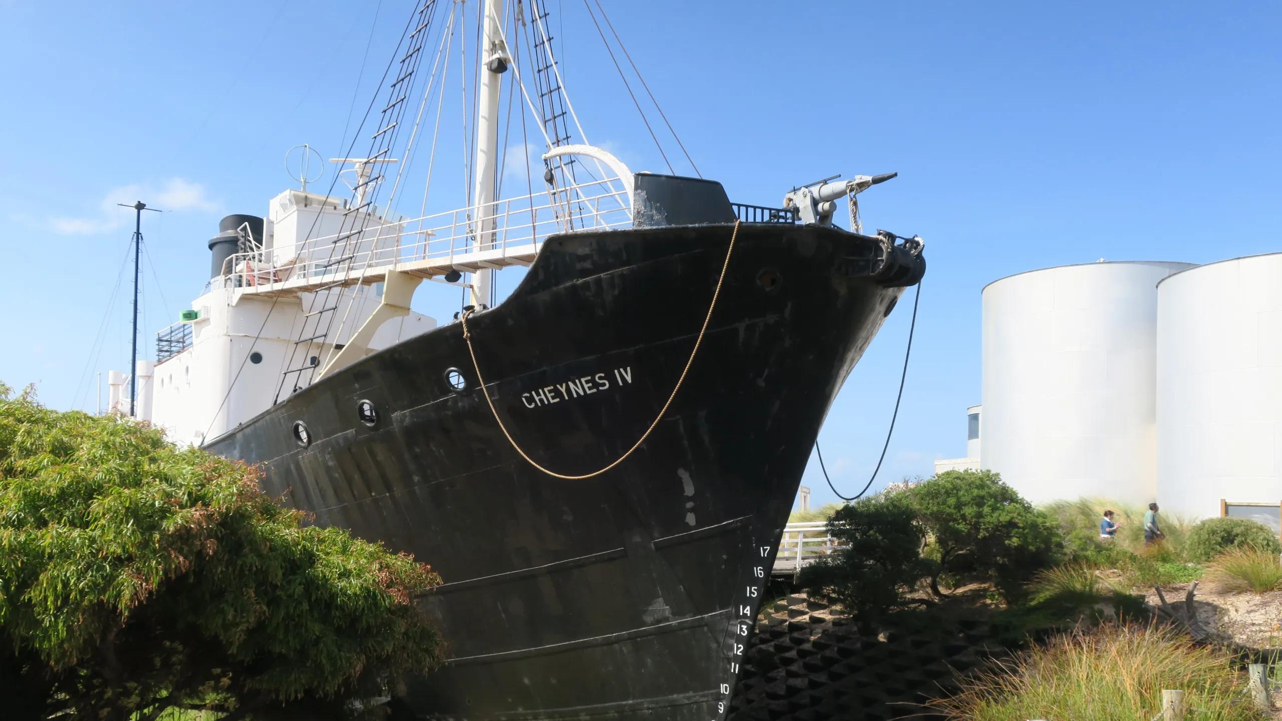 A photo of a large boat sitting on land.