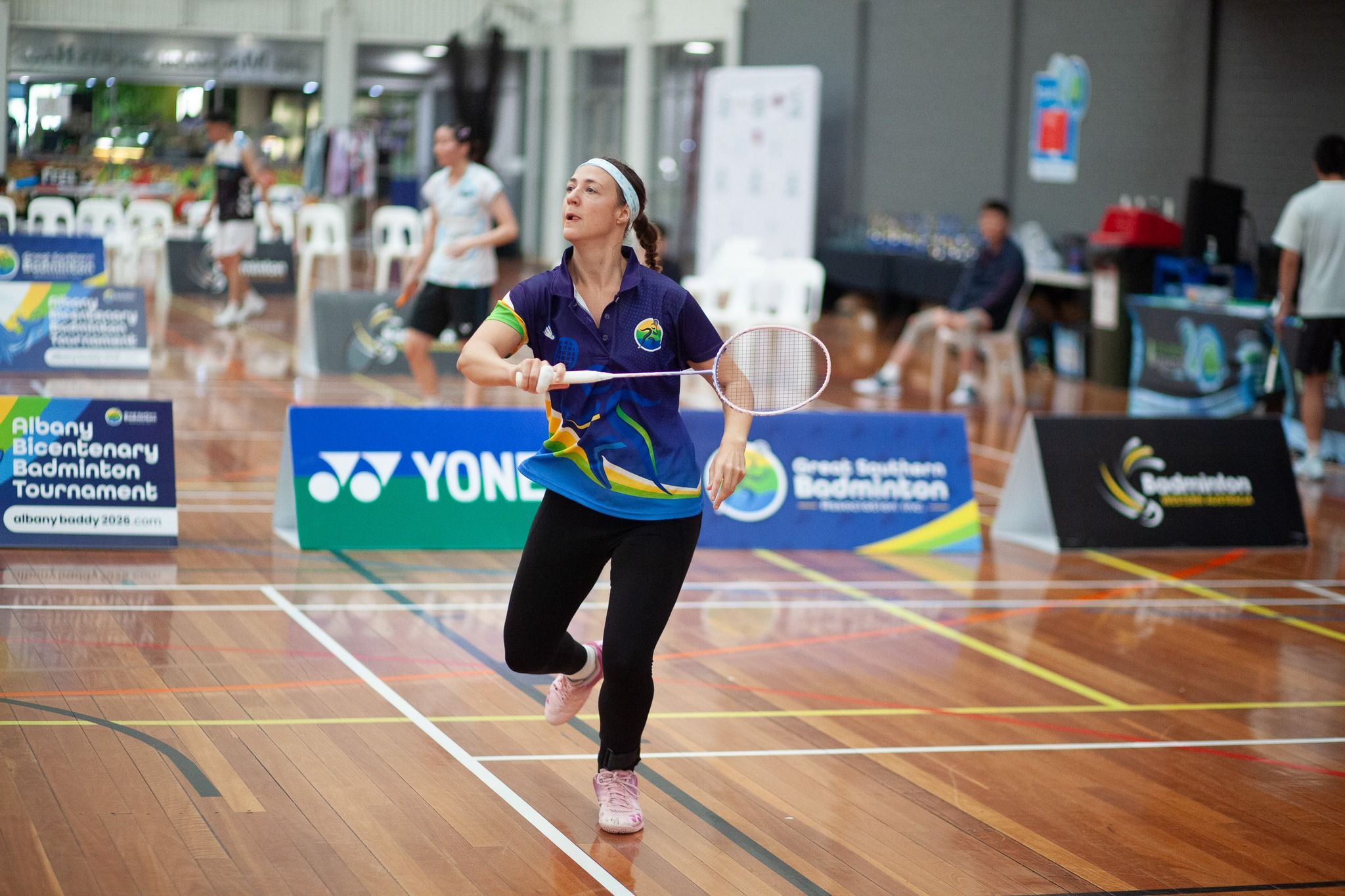 Female badminton player during game play