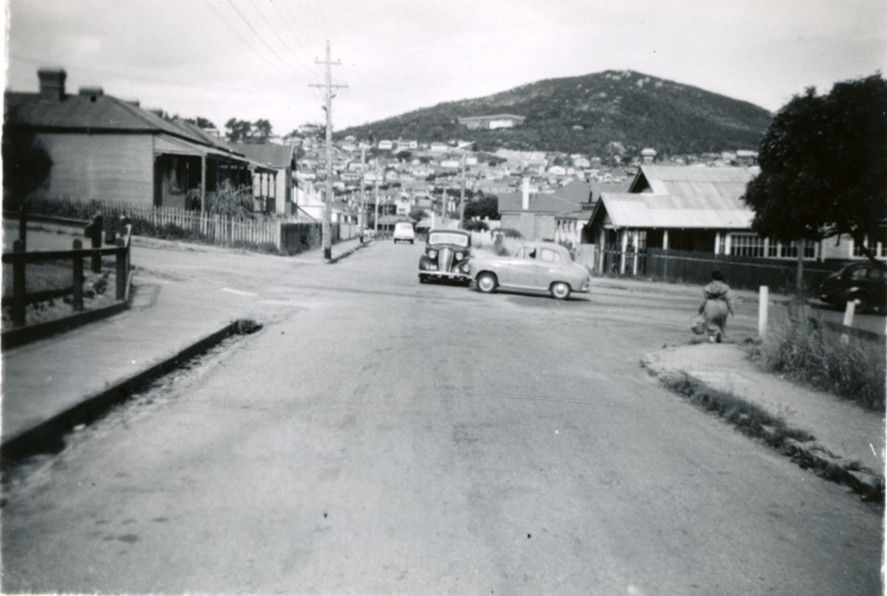 Historic black and white image of Albany street, showing drainage