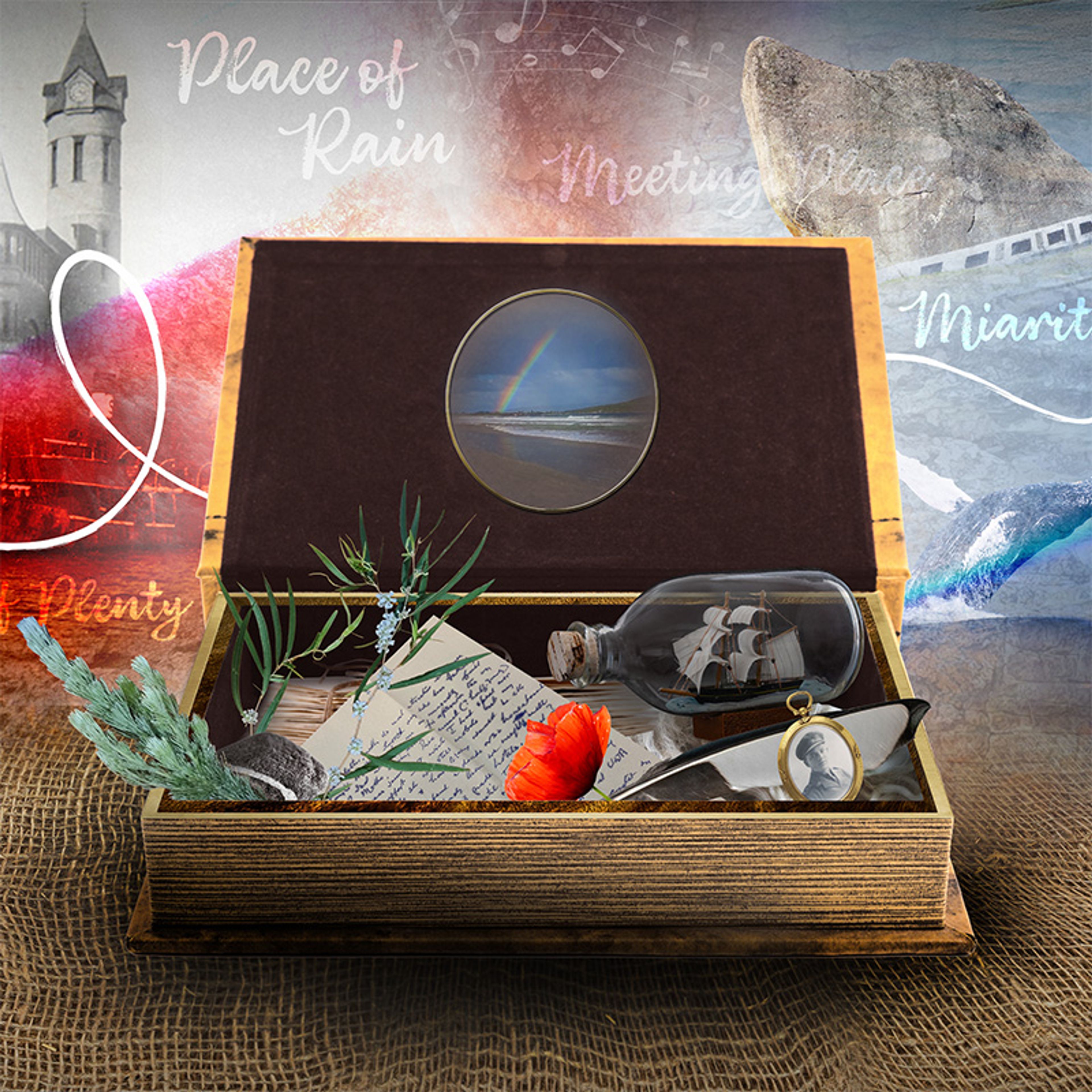 A small chest open containing a bottle, letter, poppy flower, sprig of rosemary and other items.