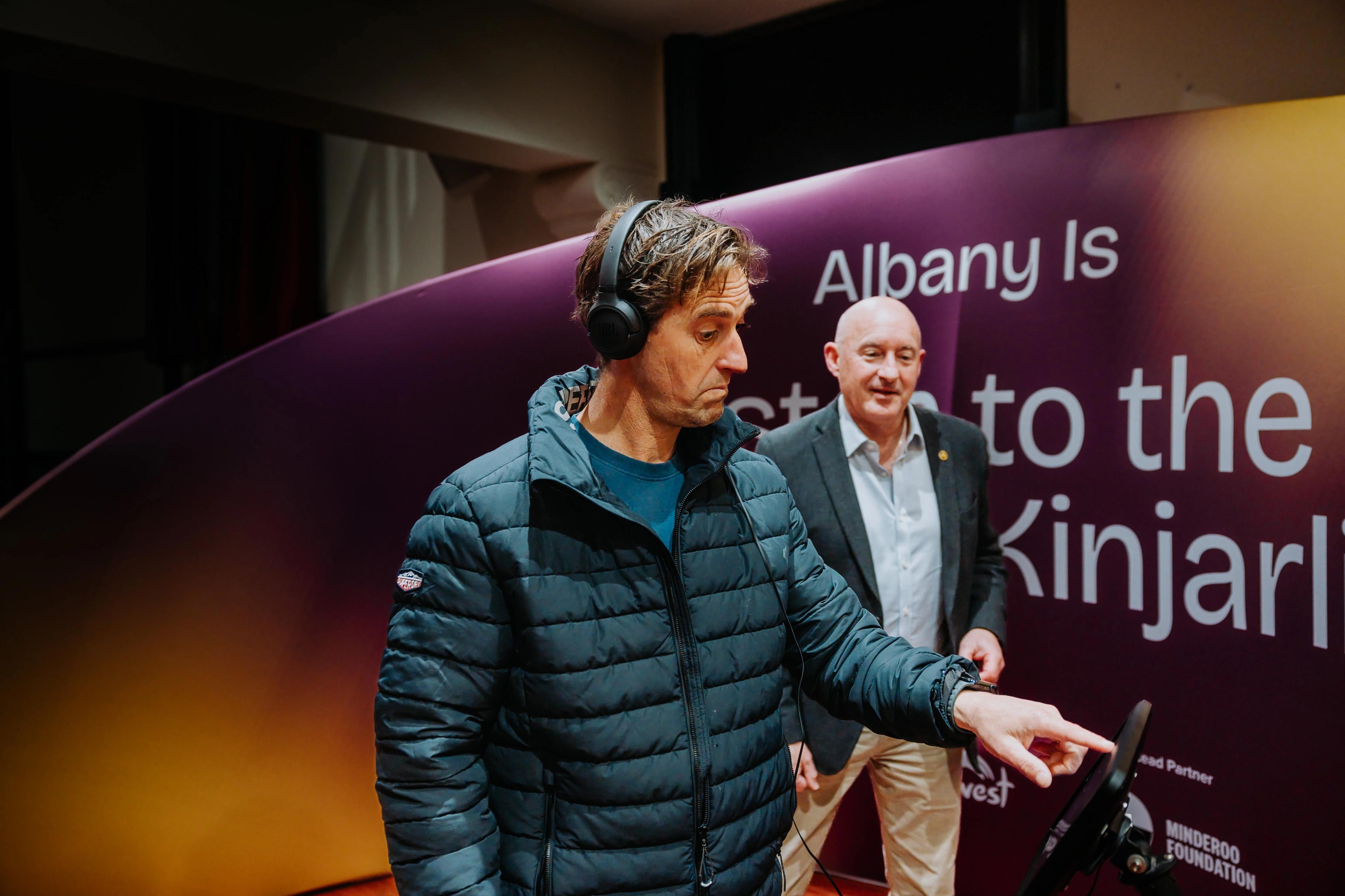 Image of two people in the Albany Is listening booth