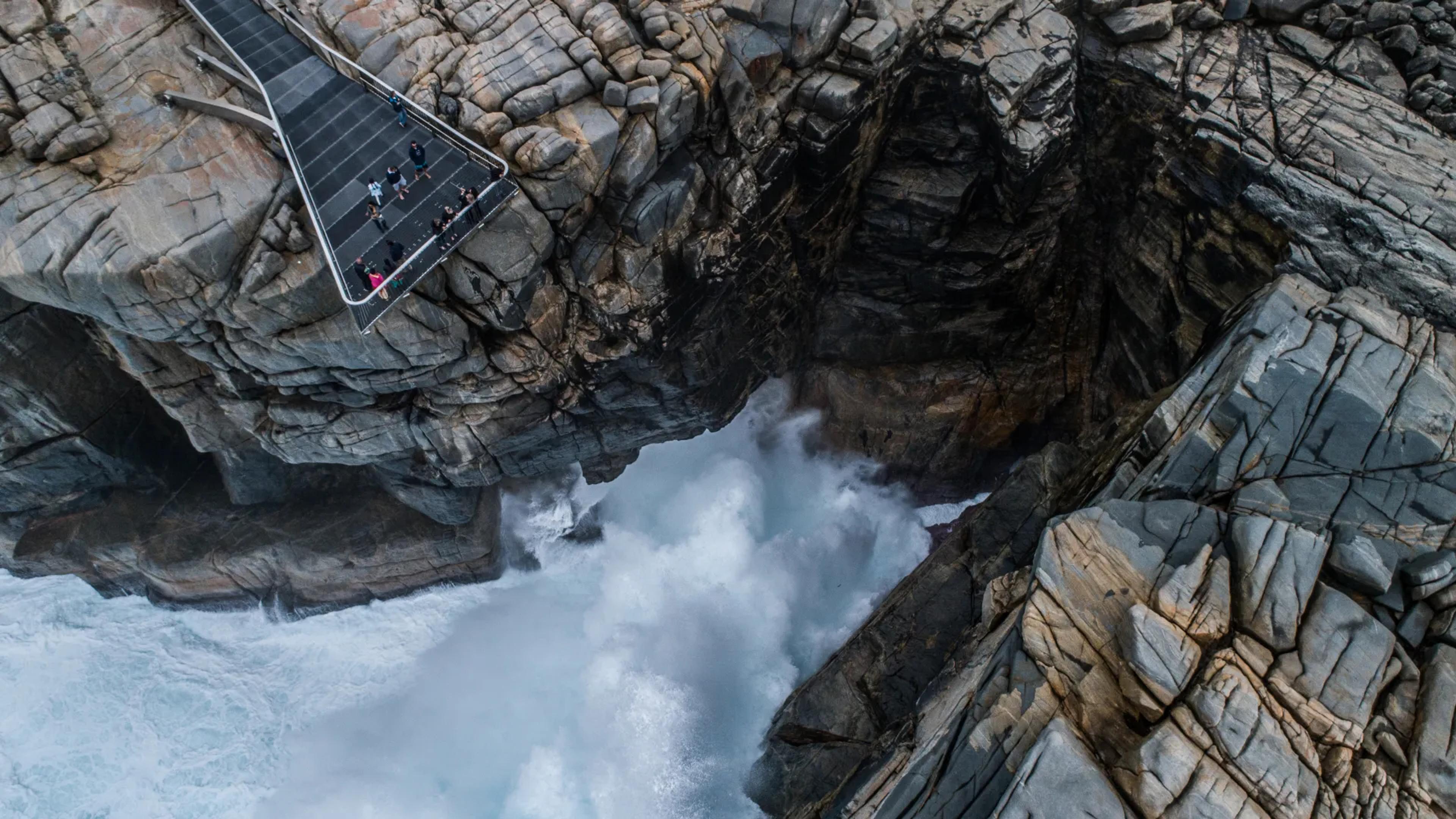 A birds eye photo of a cliff overlooking the ocean in Albany.