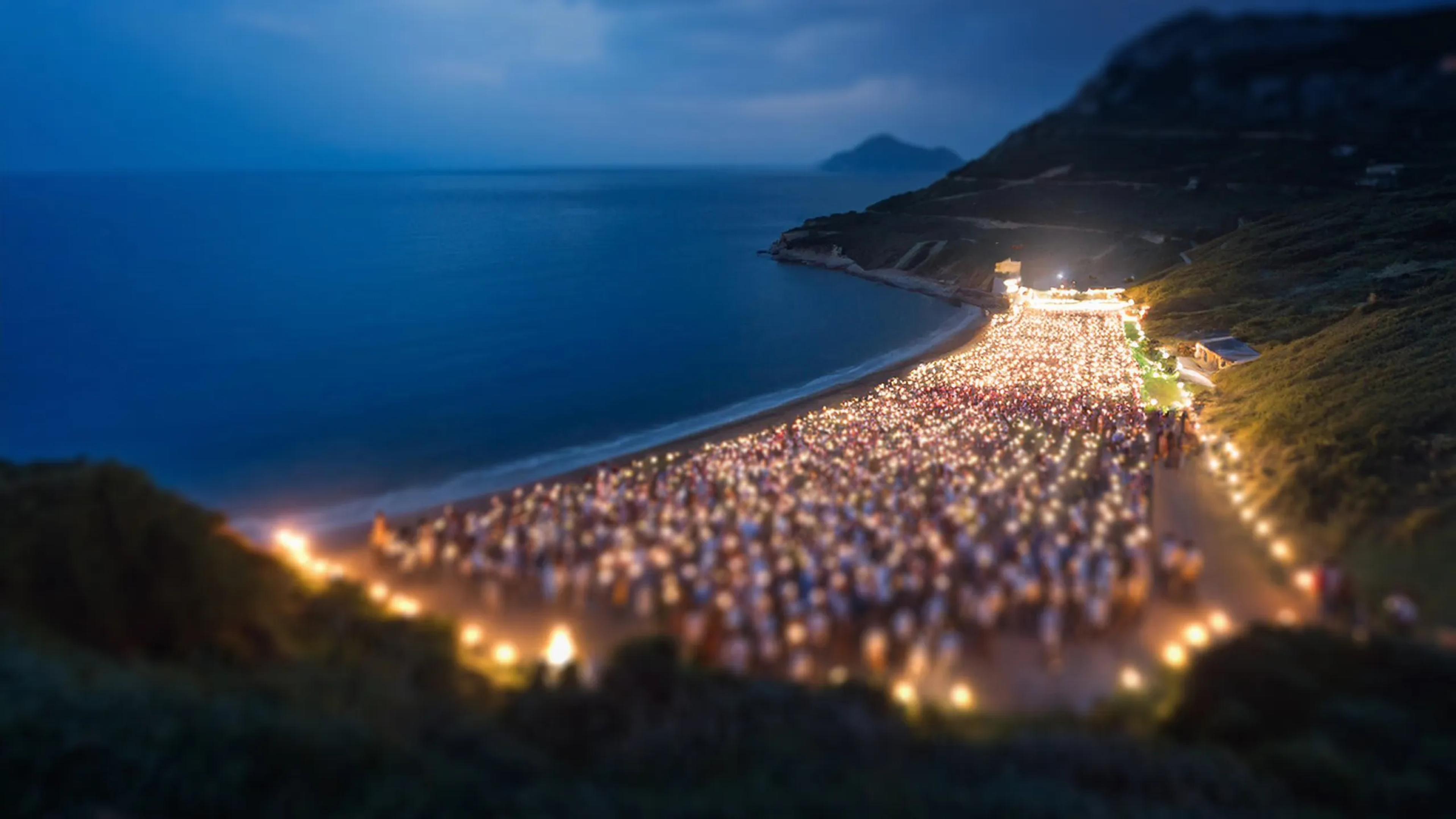 A photo of Albany with lights lit up under the night sky.