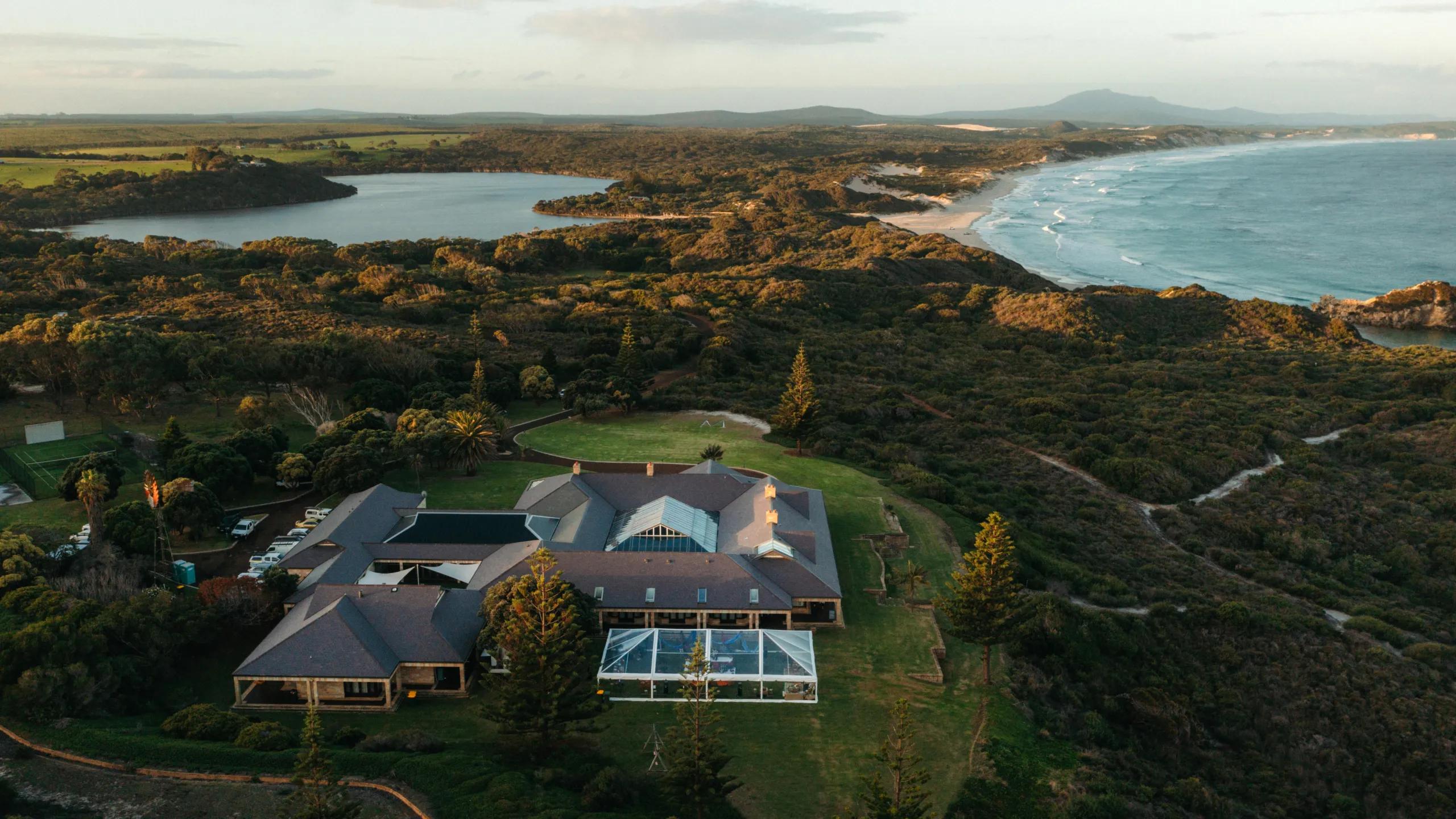 A photo of a house sitting next to the ocean in Albany.
