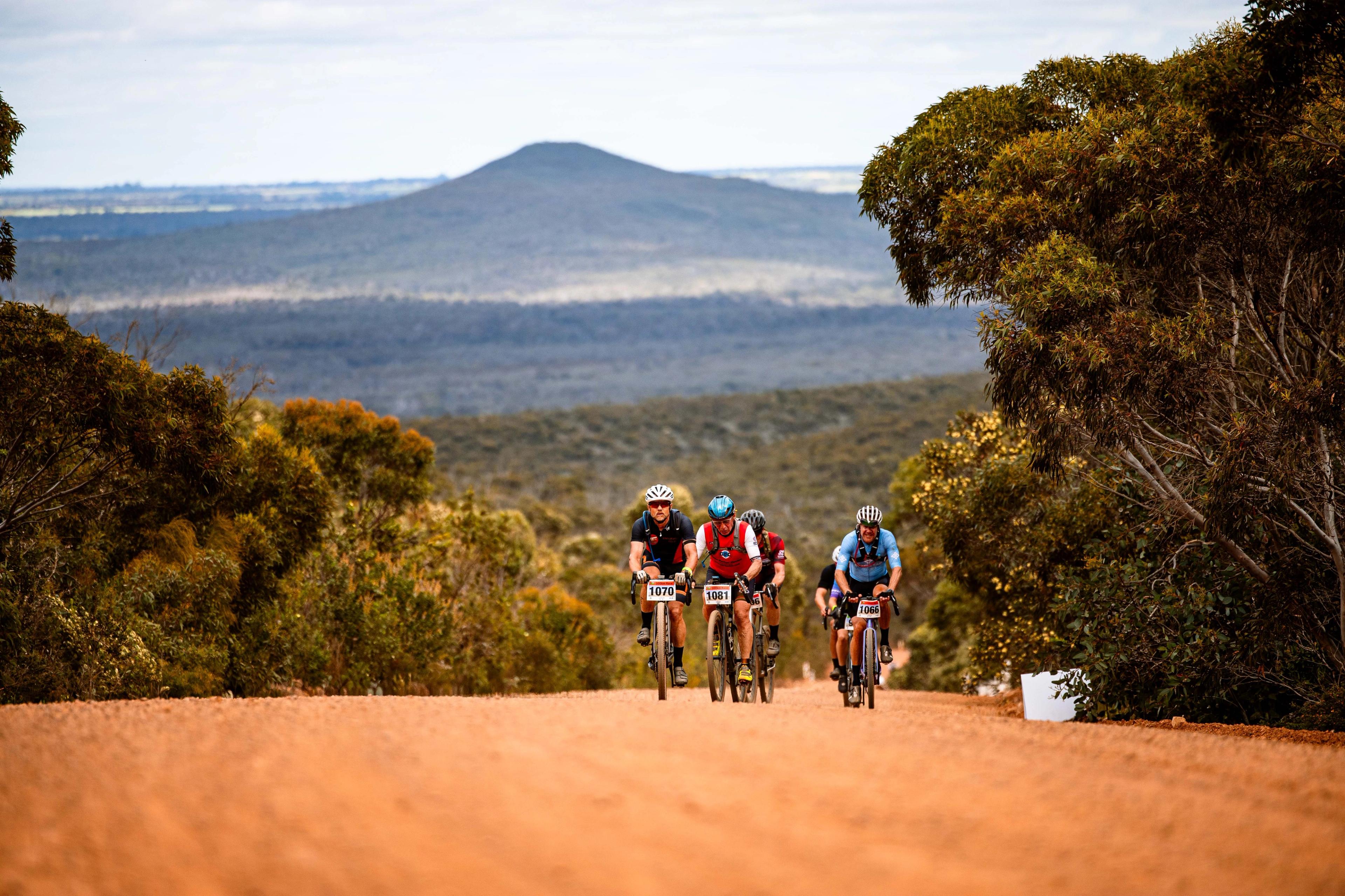 A photo of people riding their bikes