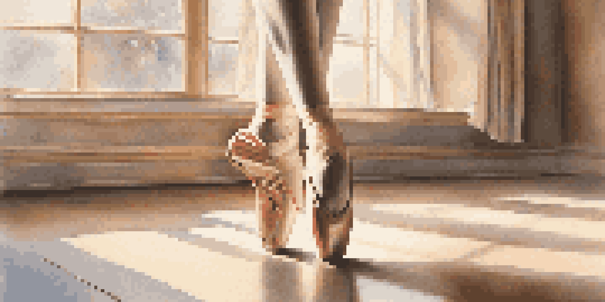 A close-up of a dancer's feet in ballet shoes on a wooden dance studio floor, with sunlight filtering through windows.