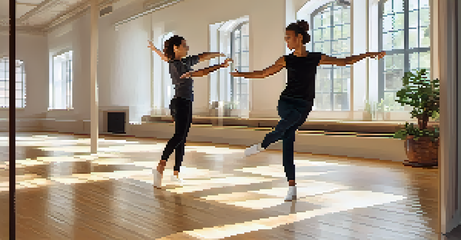 An instructor teaching dance techniques on a laptop while a student practices on the floor.