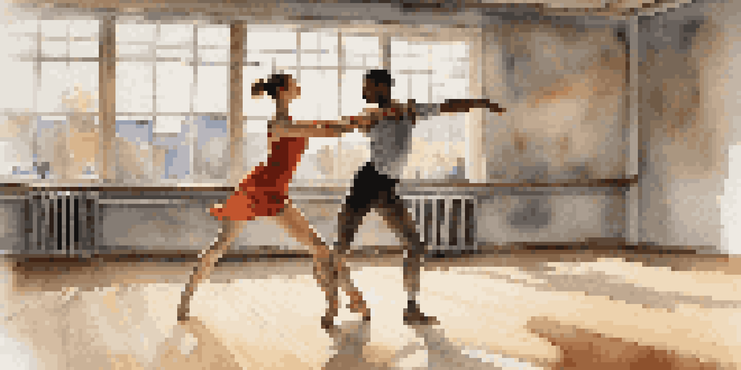 A close-up of two dancers in a rehearsal studio, one lifting the other, with expressions of trust and concentration, illuminated by natural light.