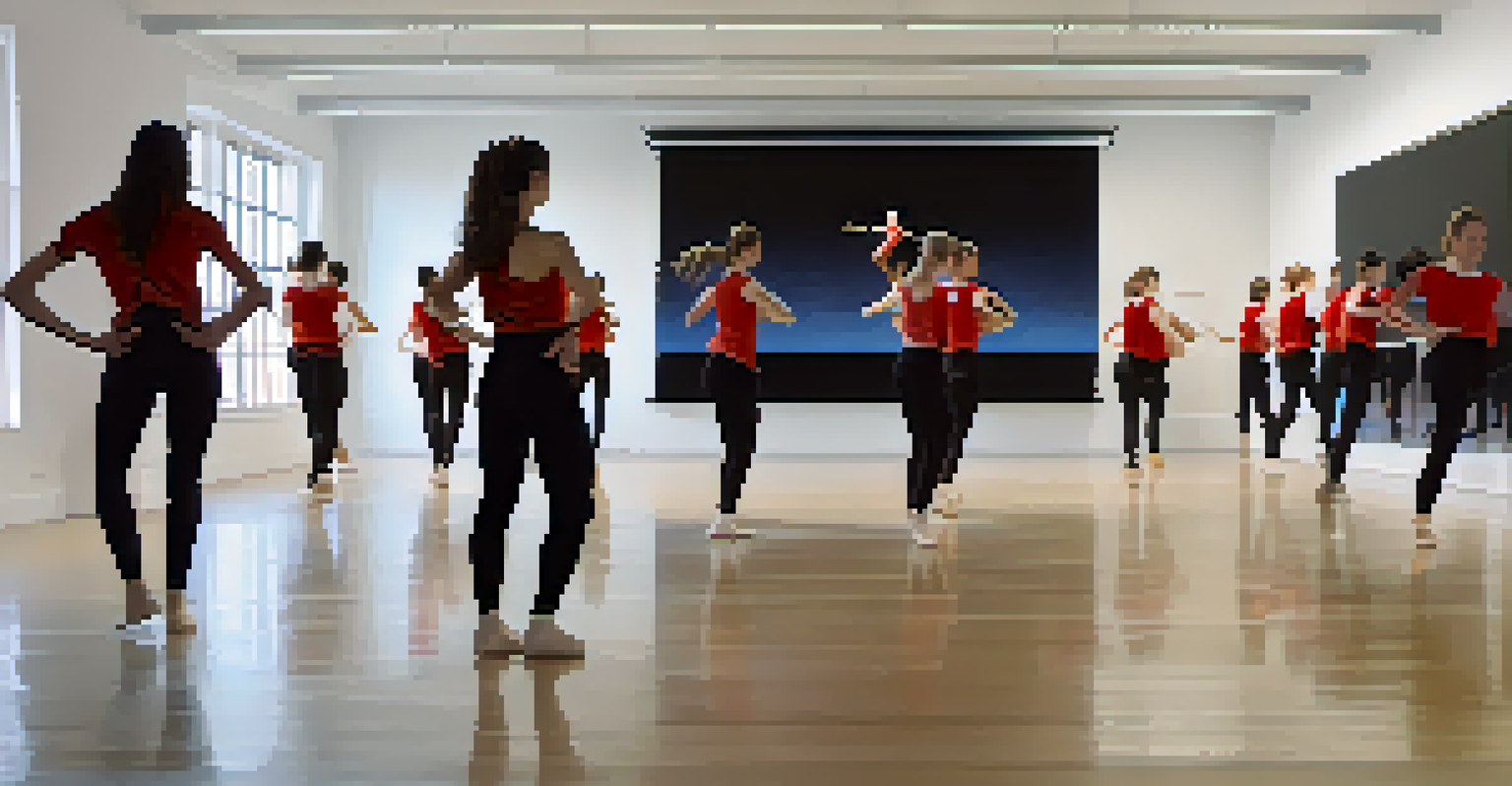 Students in a dance studio observing their movements on a large screen, integrating motion capture technology into their practice.