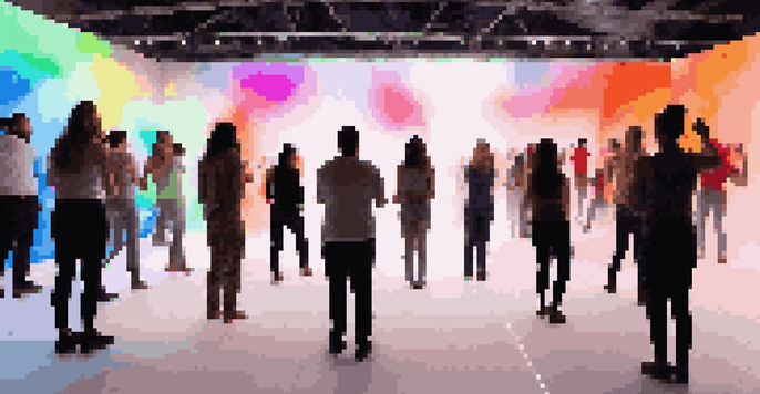 A colorful interactive dance installation with audience members dancing and colorful lights projecting onto a white canvas, creating an engaging atmosphere.