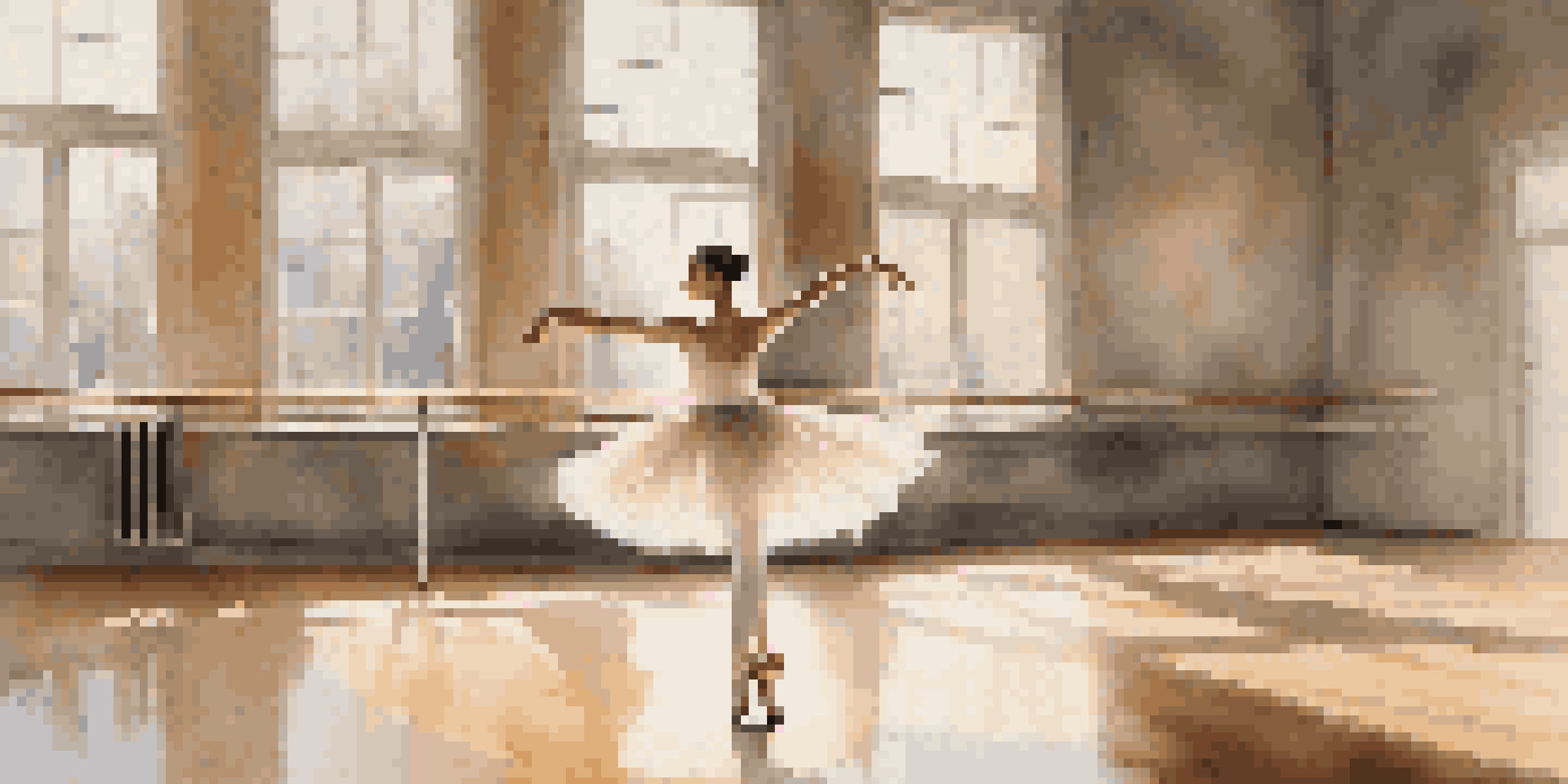 A ballet dancer performing a pirouette in a softly lit studio with wooden floors and mirrors.