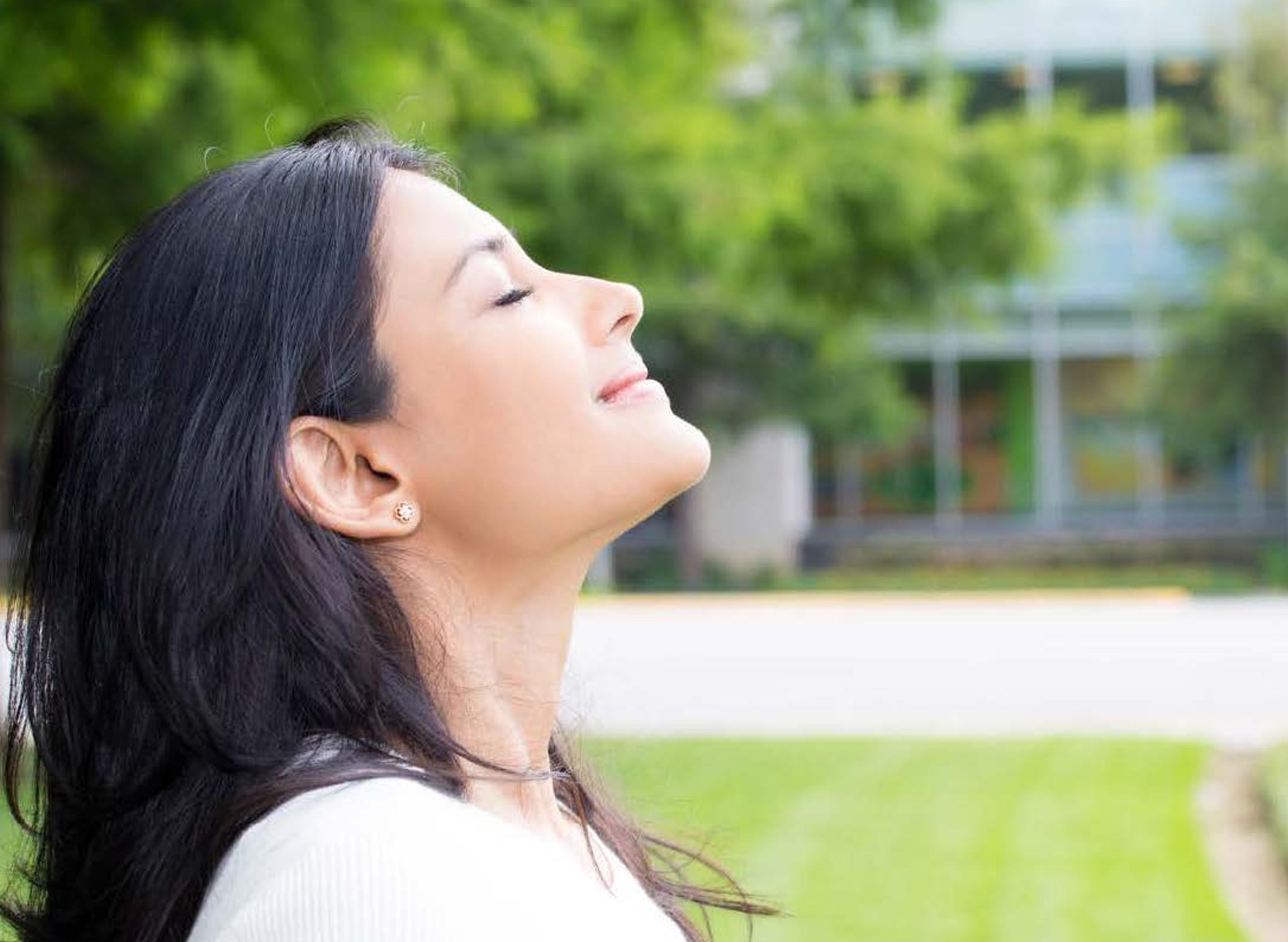 woman breathing fresh air