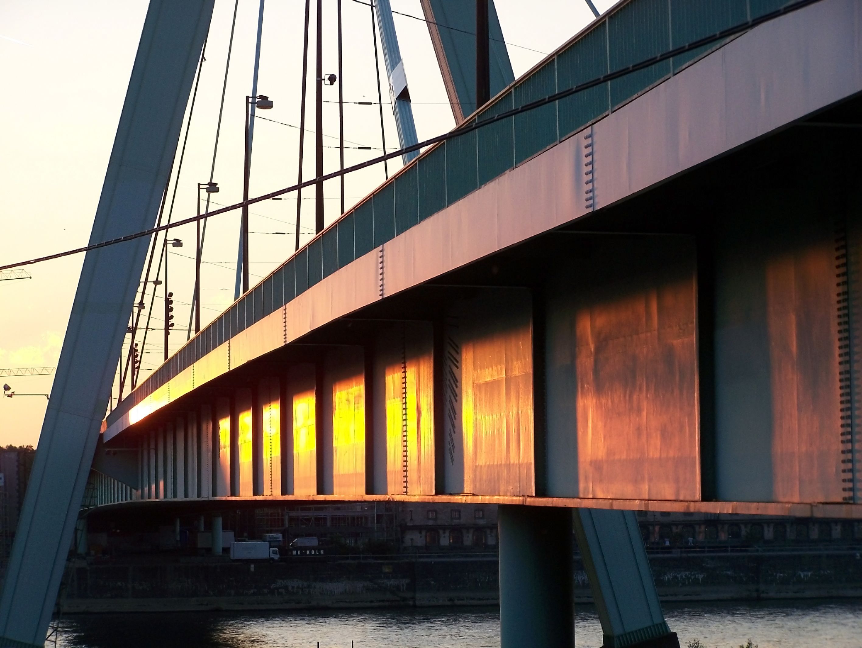 Steel bridge architecture with strong structural lines and spanning cables.