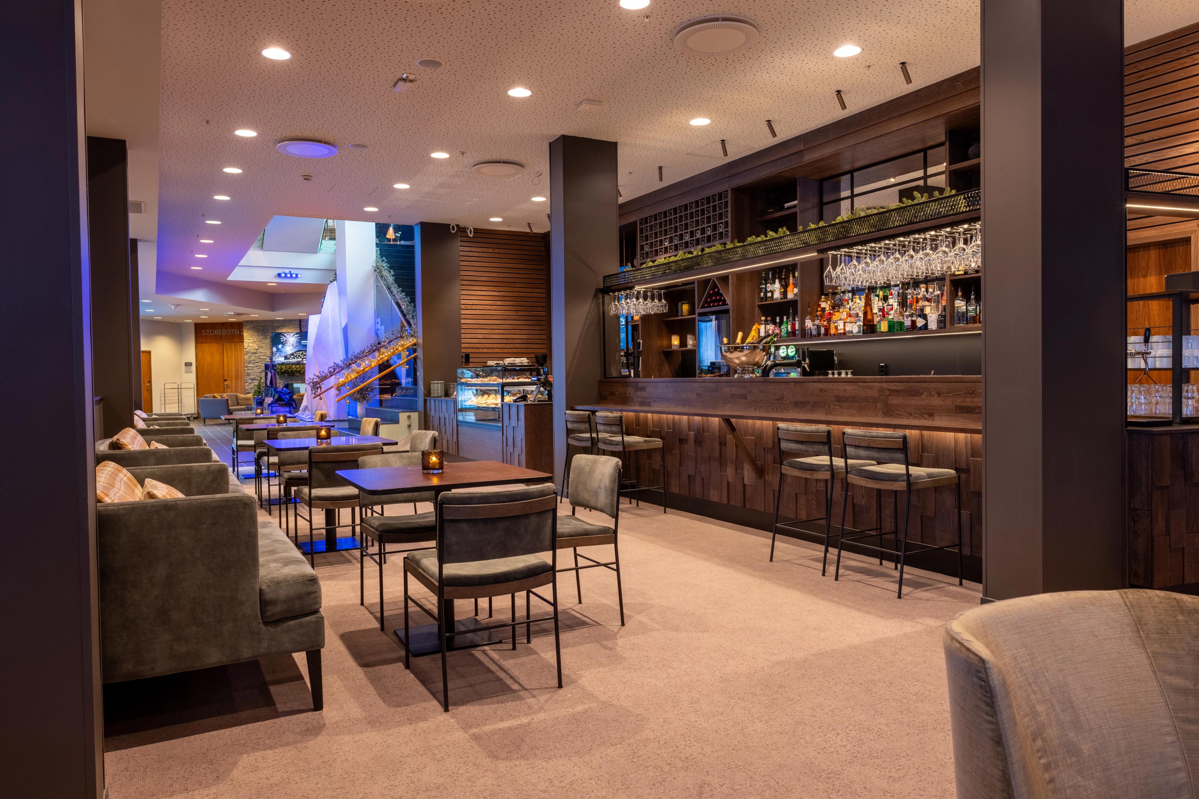 A bar in dark in dark wood colors