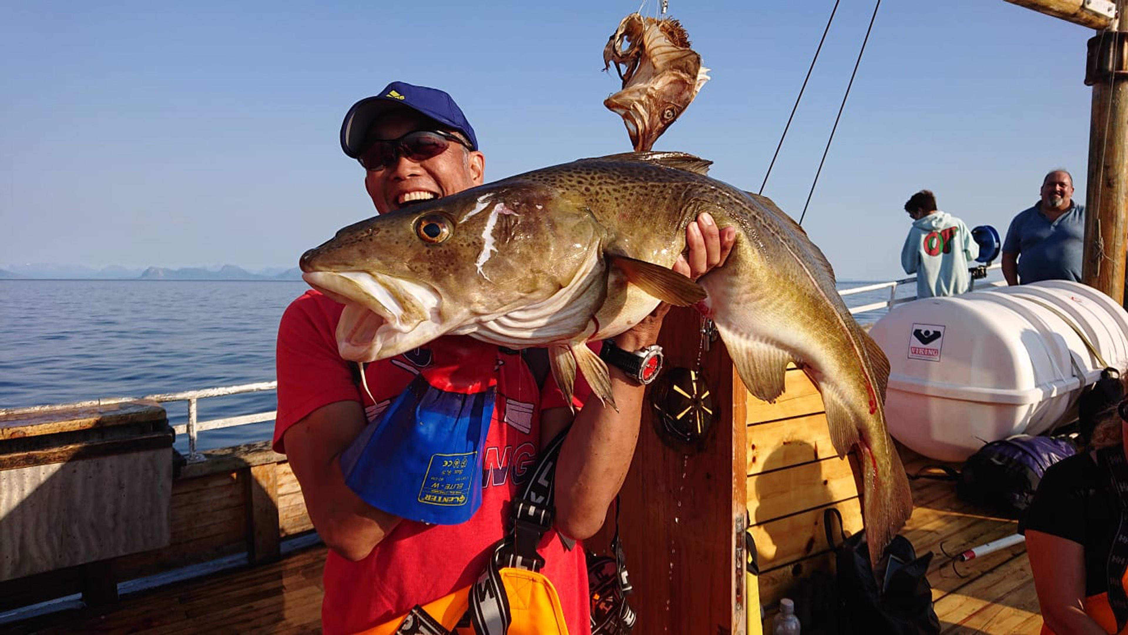 Man shows off a huge cod