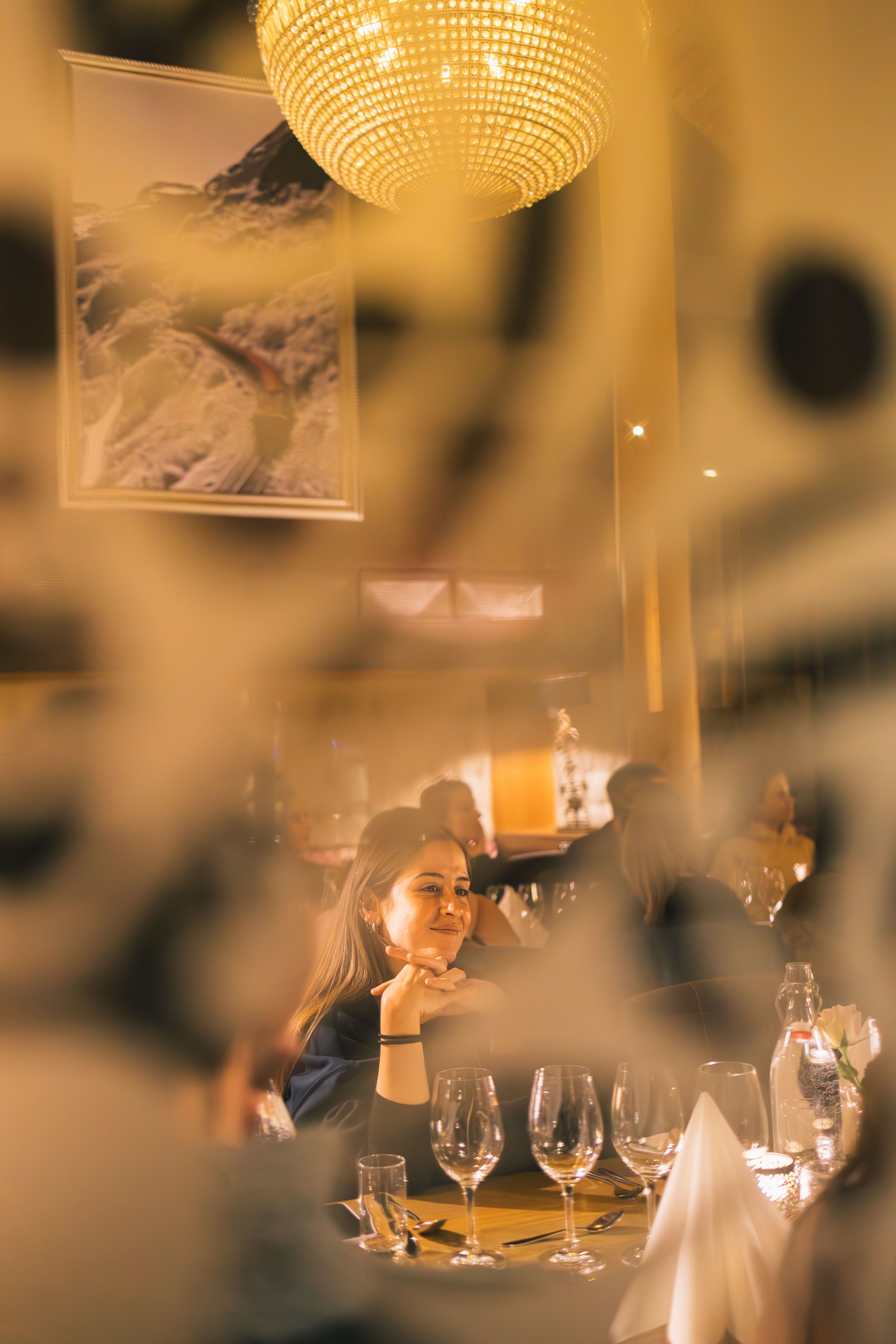 Girl sitting at a table at Arven Restaurant