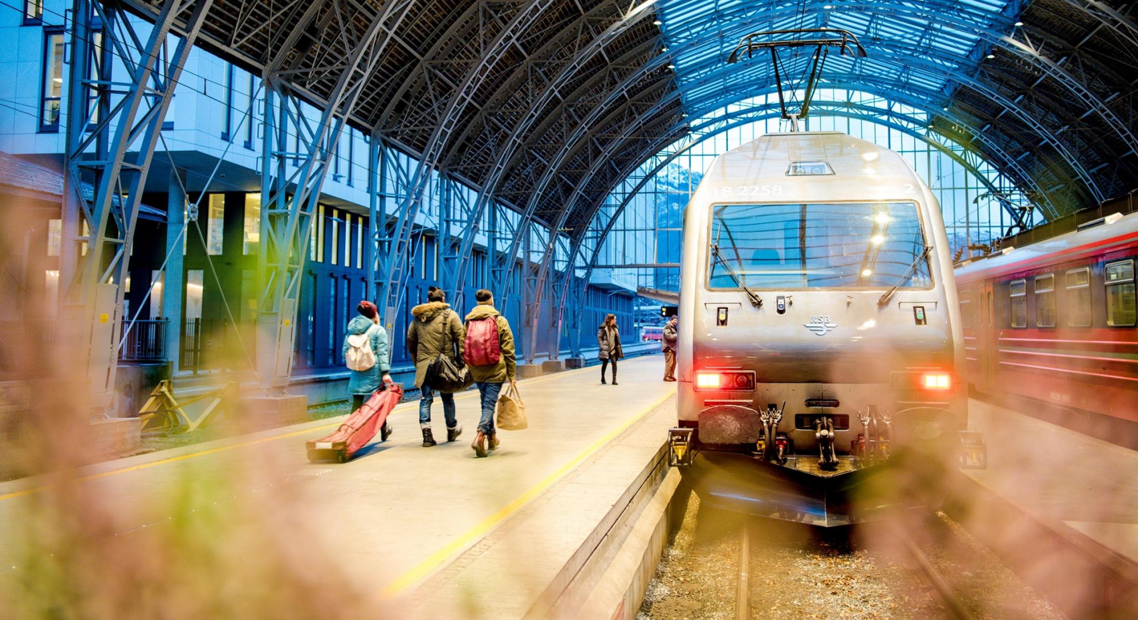 The train is waiting in the station hall for the passengers who are going on a mountain trip.