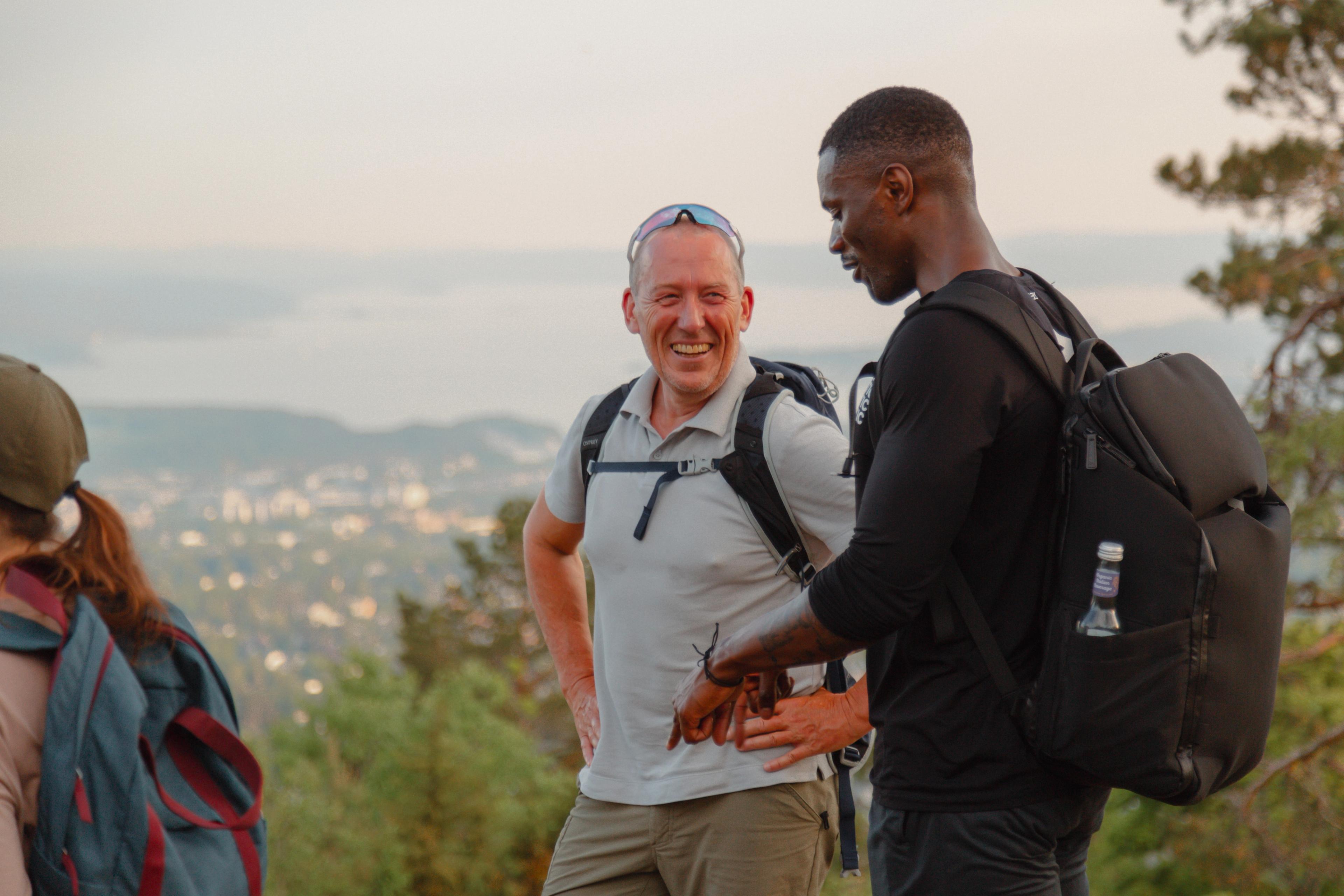 A old and and a younger man talking and laughing