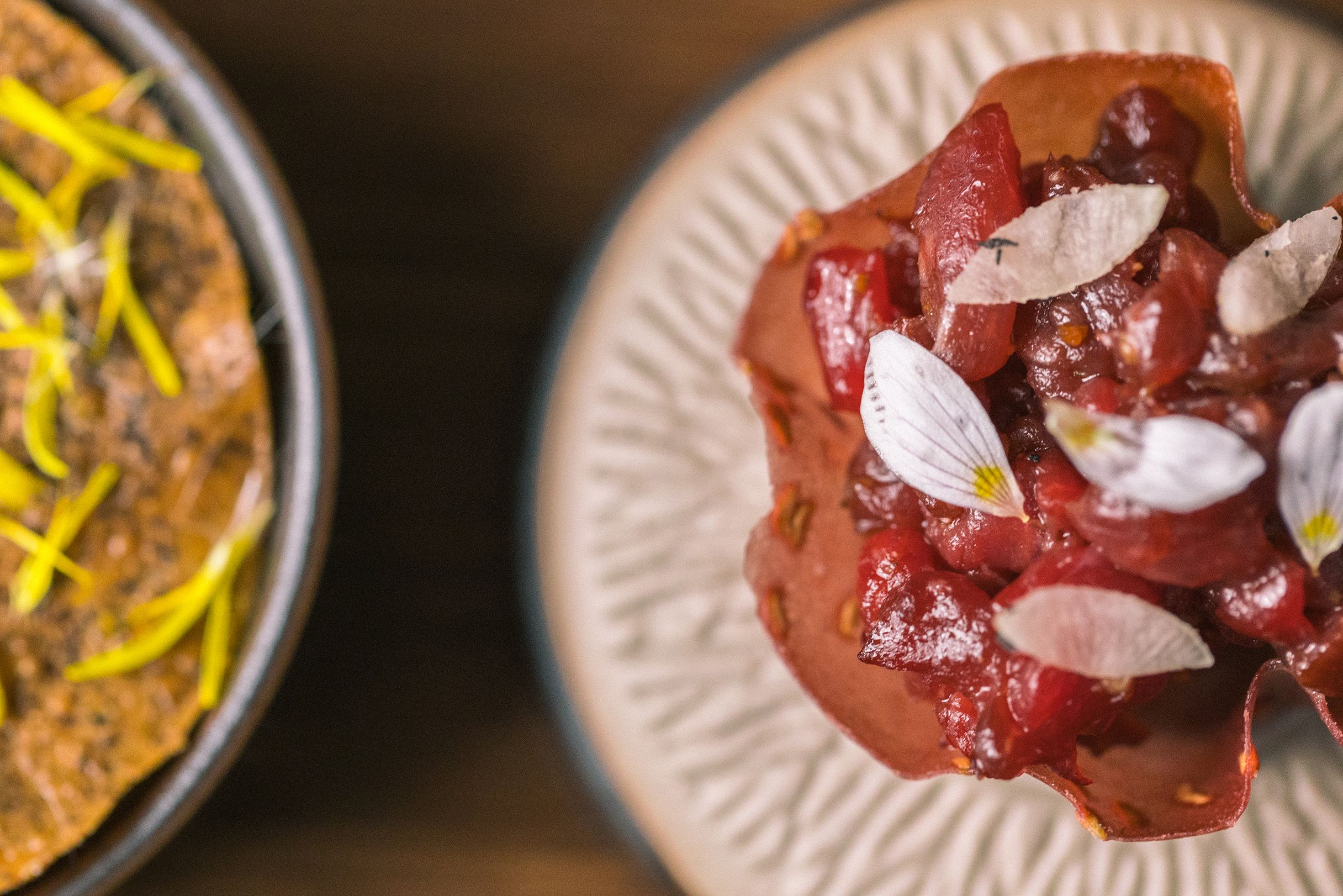 Close-up of an exclusive dish with floral decoration.