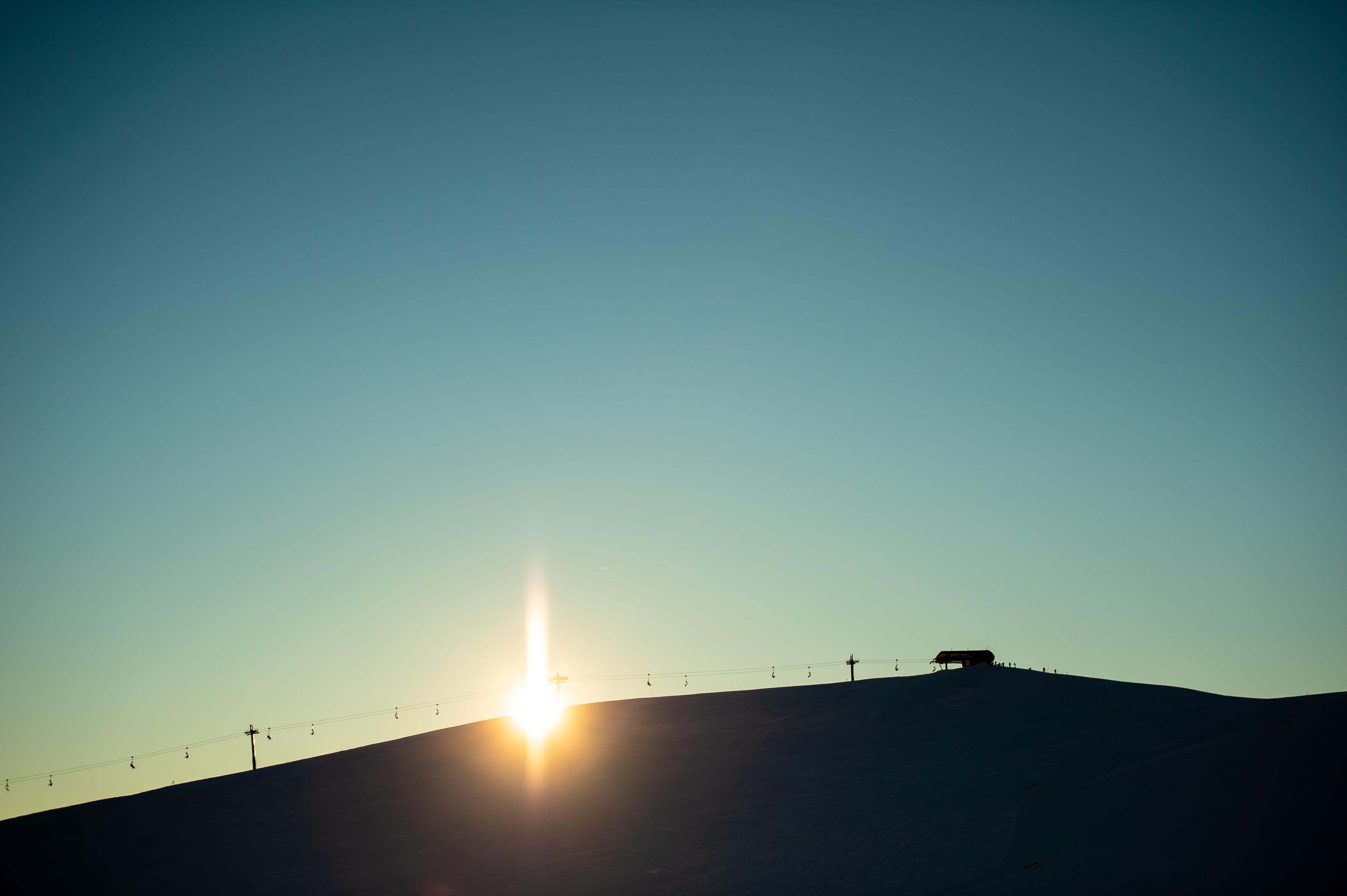 The sun rises over a ski resort