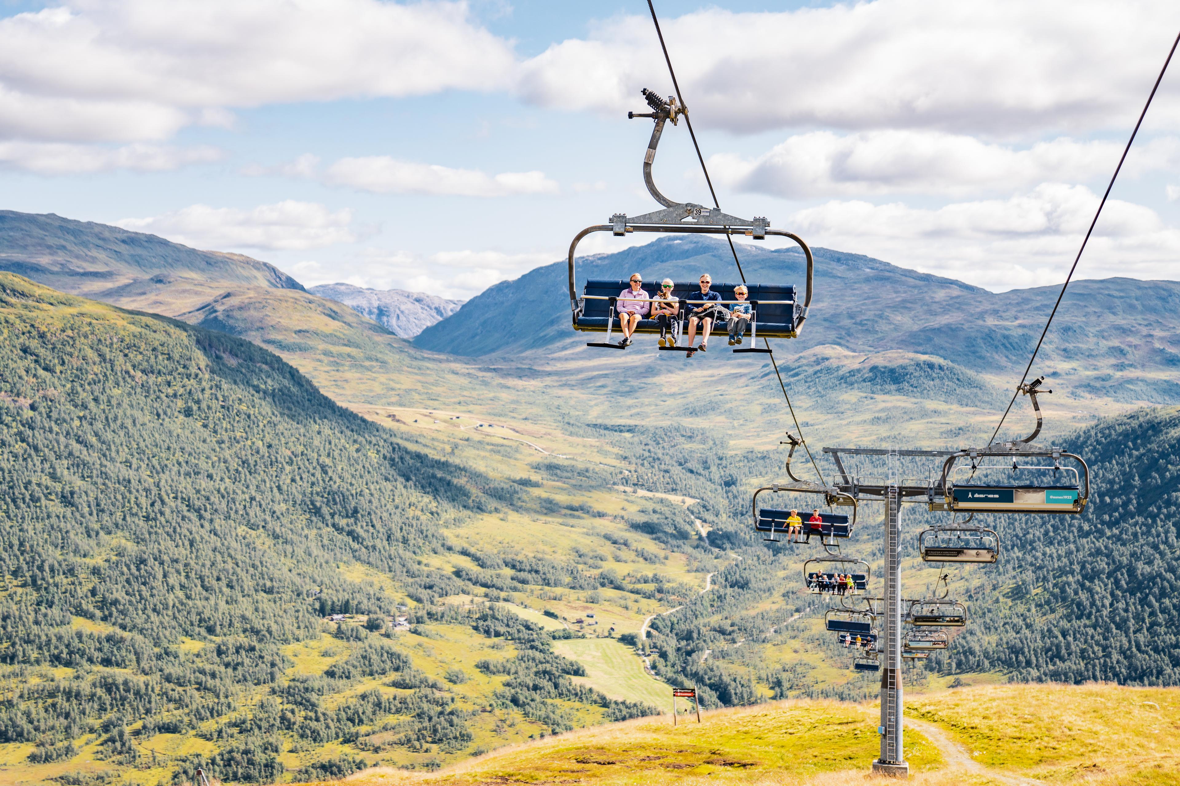 Many people take the chairlift up the mountain in summer.