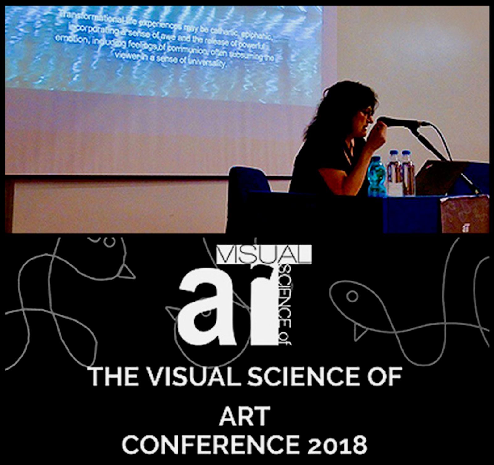 The artist Sadia Sadia presenting The Sacred Ground: Enhancing and Constructing the Transcendent State in the Installation Environment at the Visual Science of Art Conference (VSAC) in Trieste, Italy, August 2018.