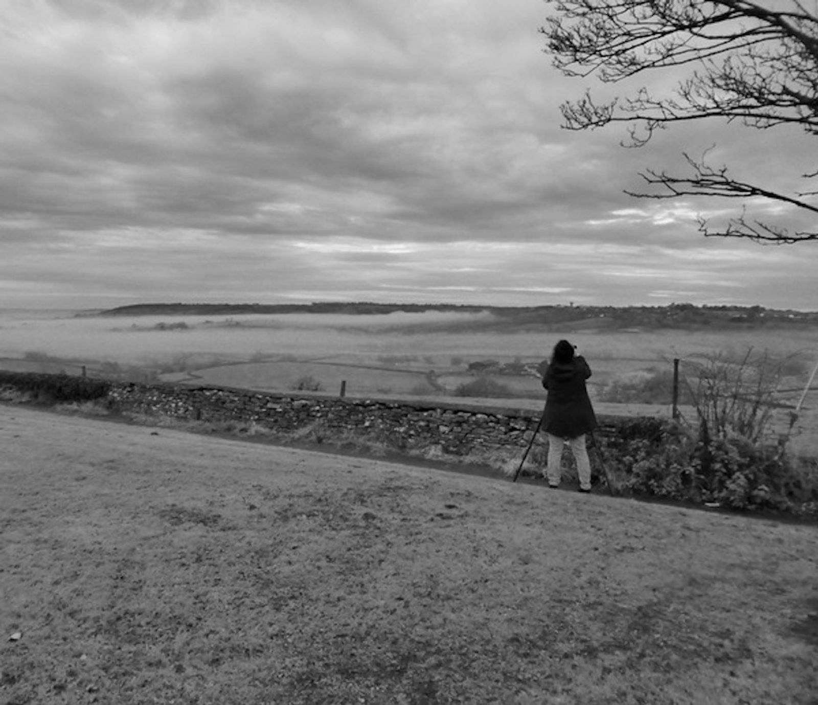 The artist Sadia Sadia filming Every Fallen Leaf Sings on Your Shore (Box Hill at Dawn) in Wiltshire, November 2017, as part of her research into transcendence and the grand vista.