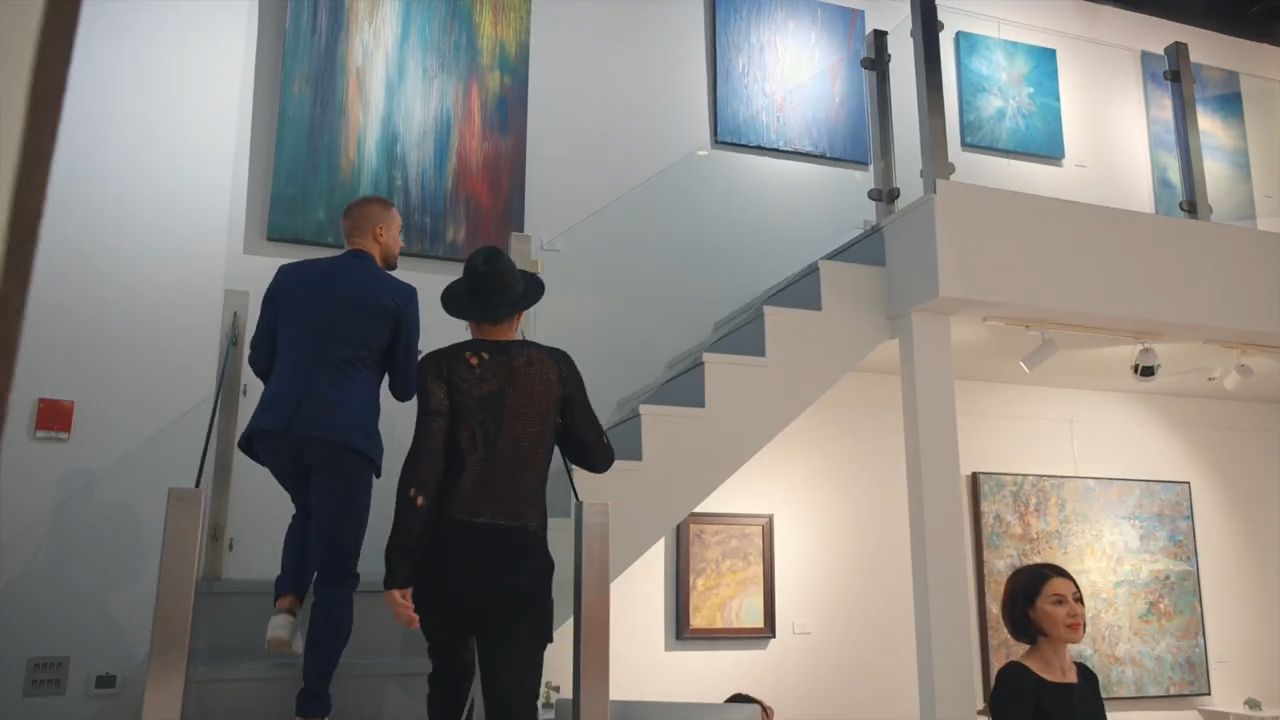 Visitors on the stairs between the two floors of Andakulova Gallery during Almaz