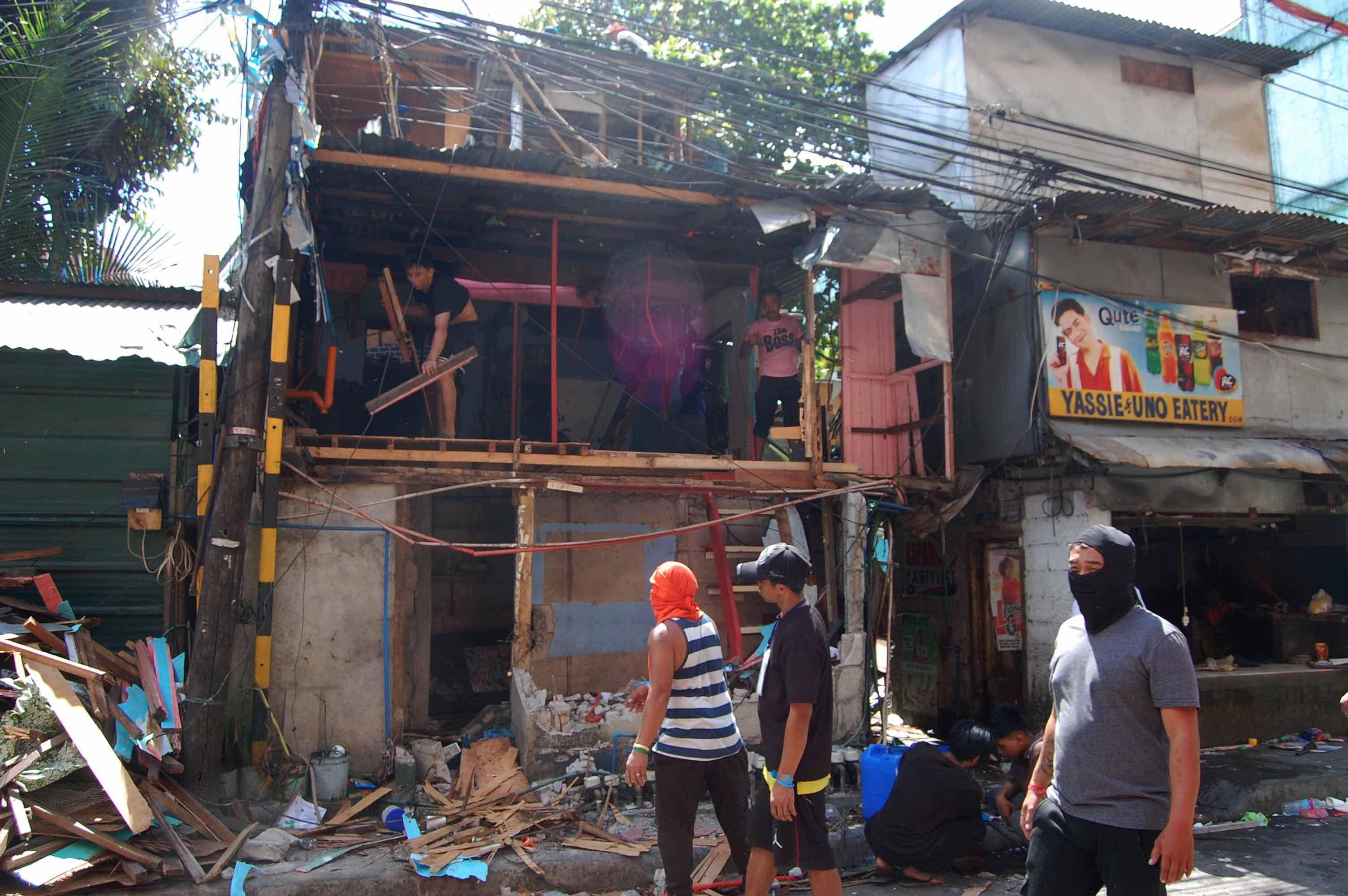 HOUSES DEMOLISHED IN QC