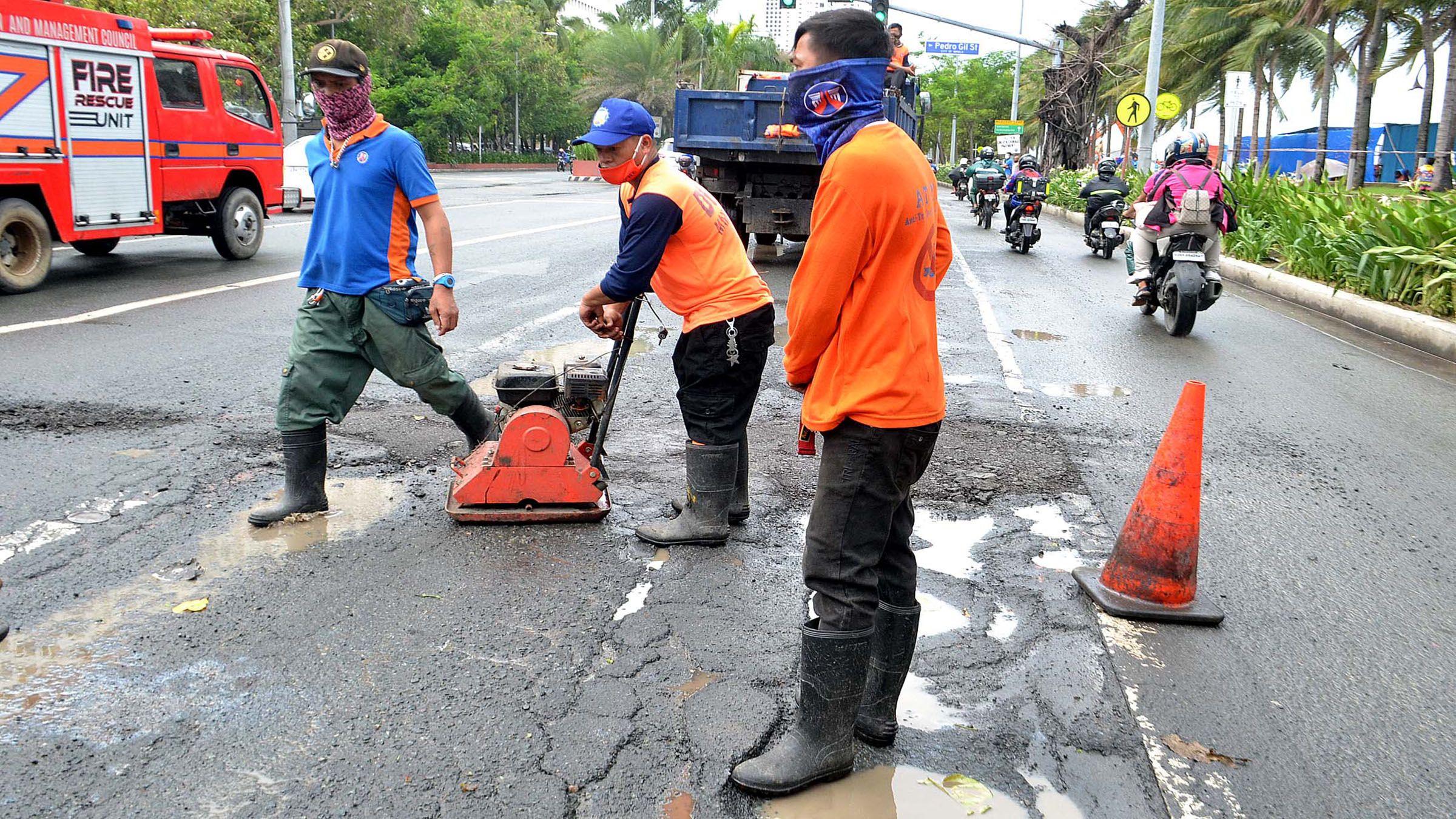 DPWH FAST-TRACKS ROAD REPAIRS photo by Mike Taboy