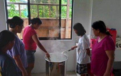 Antique loom weavers produce natural dyed fabrics